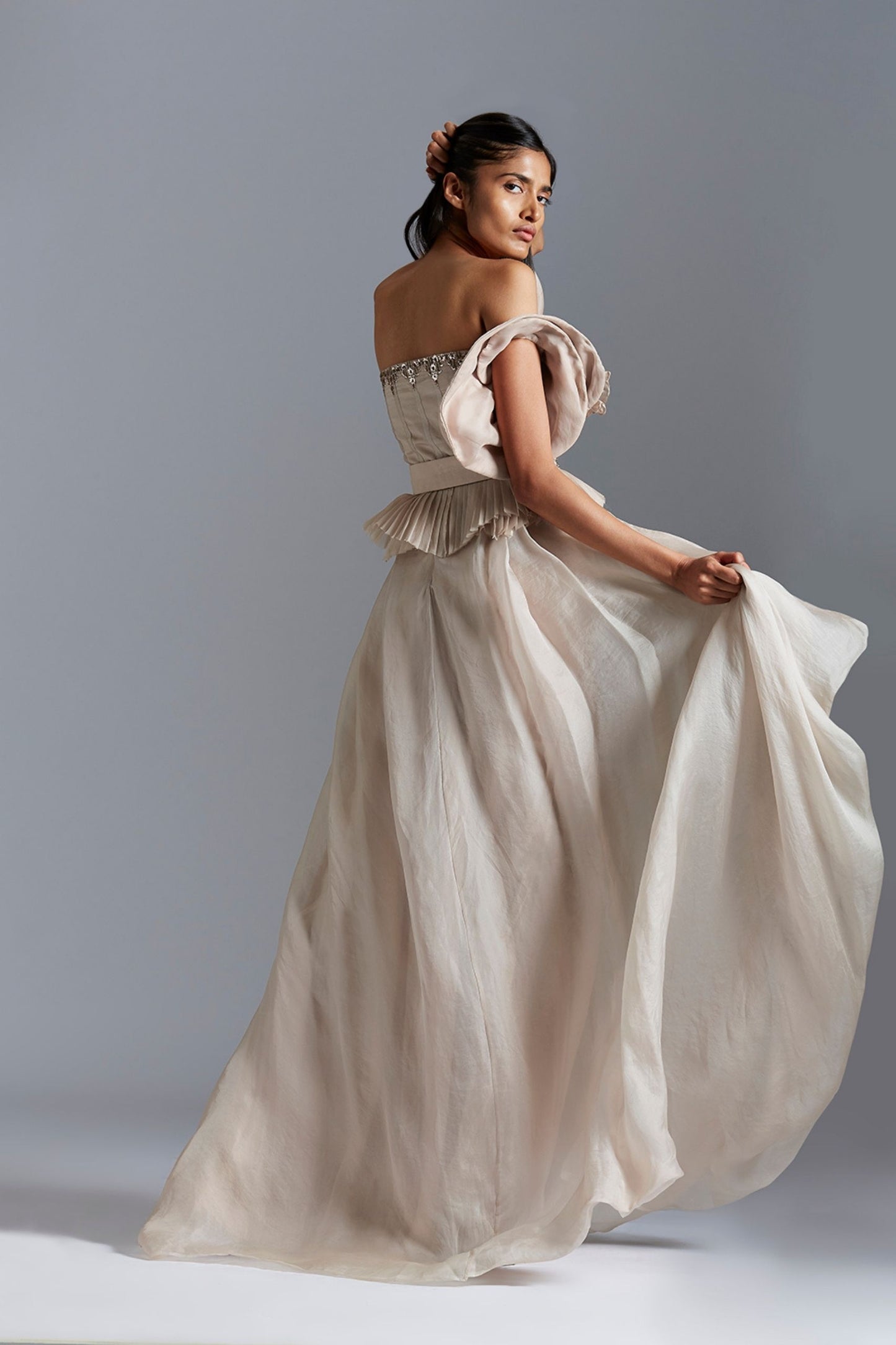 Back view of the corset top and skirt set, showcasing the elegant back design and detailed Mukaish embroidery