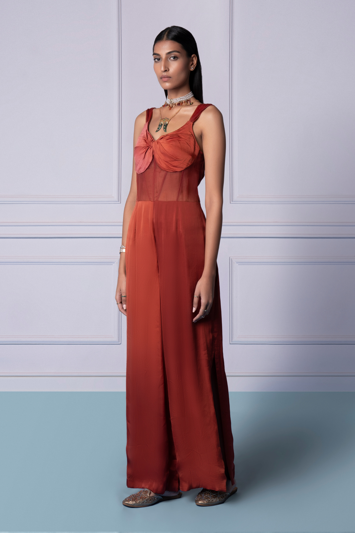 Side view of Namib jumpsuit showcasing the side slits and corset detail