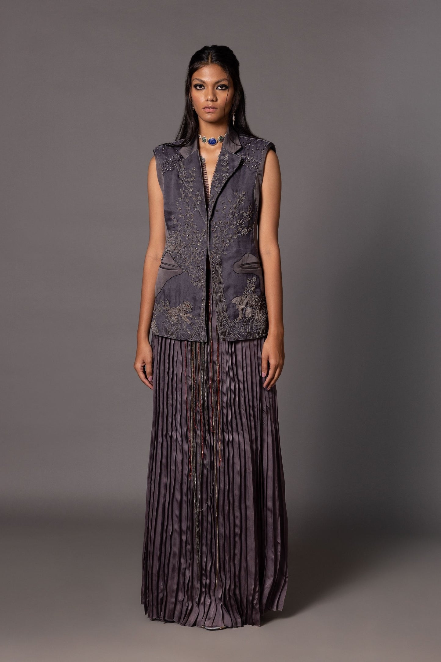 Shikhar Baugh Embroidered Jacket with Jaipur motifs, paired with a hand-pleated skirt, perfect for women seeking unique, custom clothing