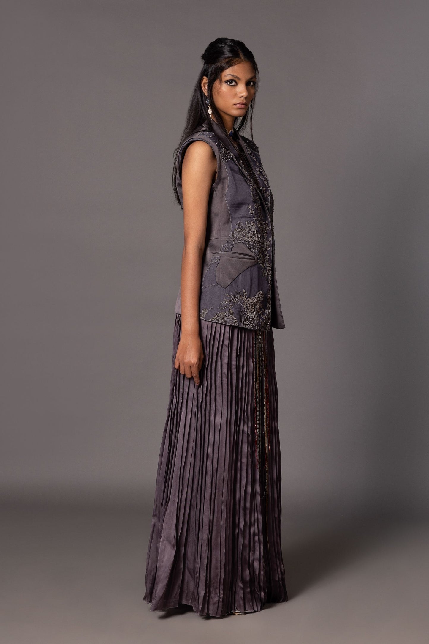 Side view of the Shikhar Baugh Embroidered Jacket and pleated skirt set, showing the silhouette and pleating details