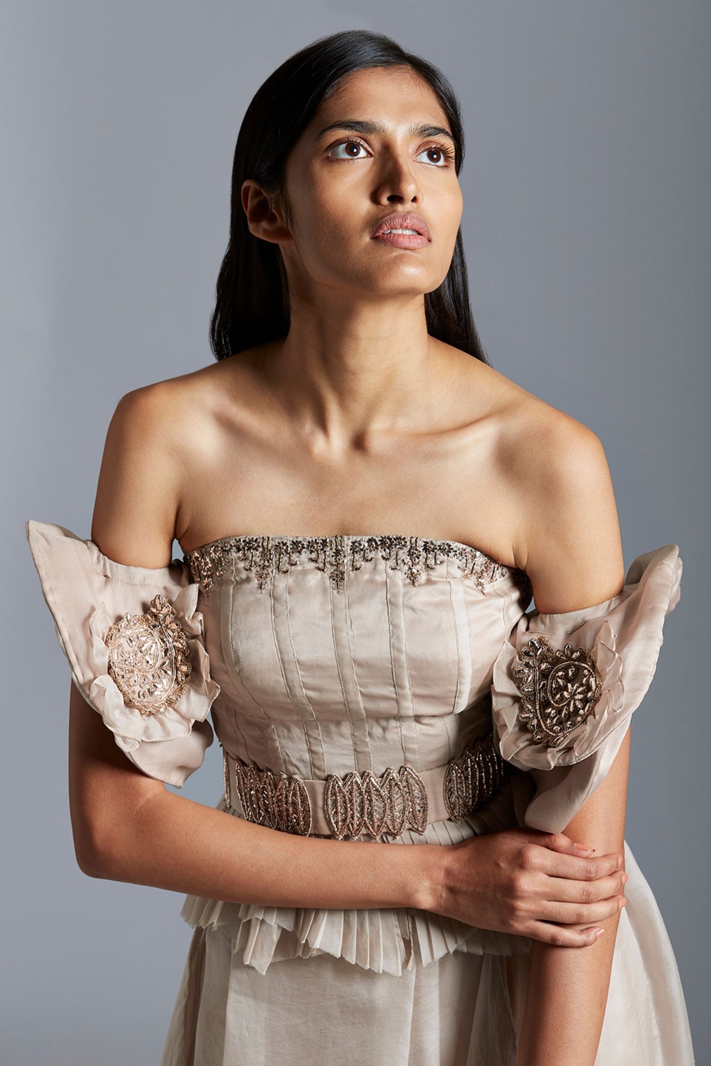 Close-up of the intricate Mukaish handwork on the corset top and skirt, showcasing the fine detailing