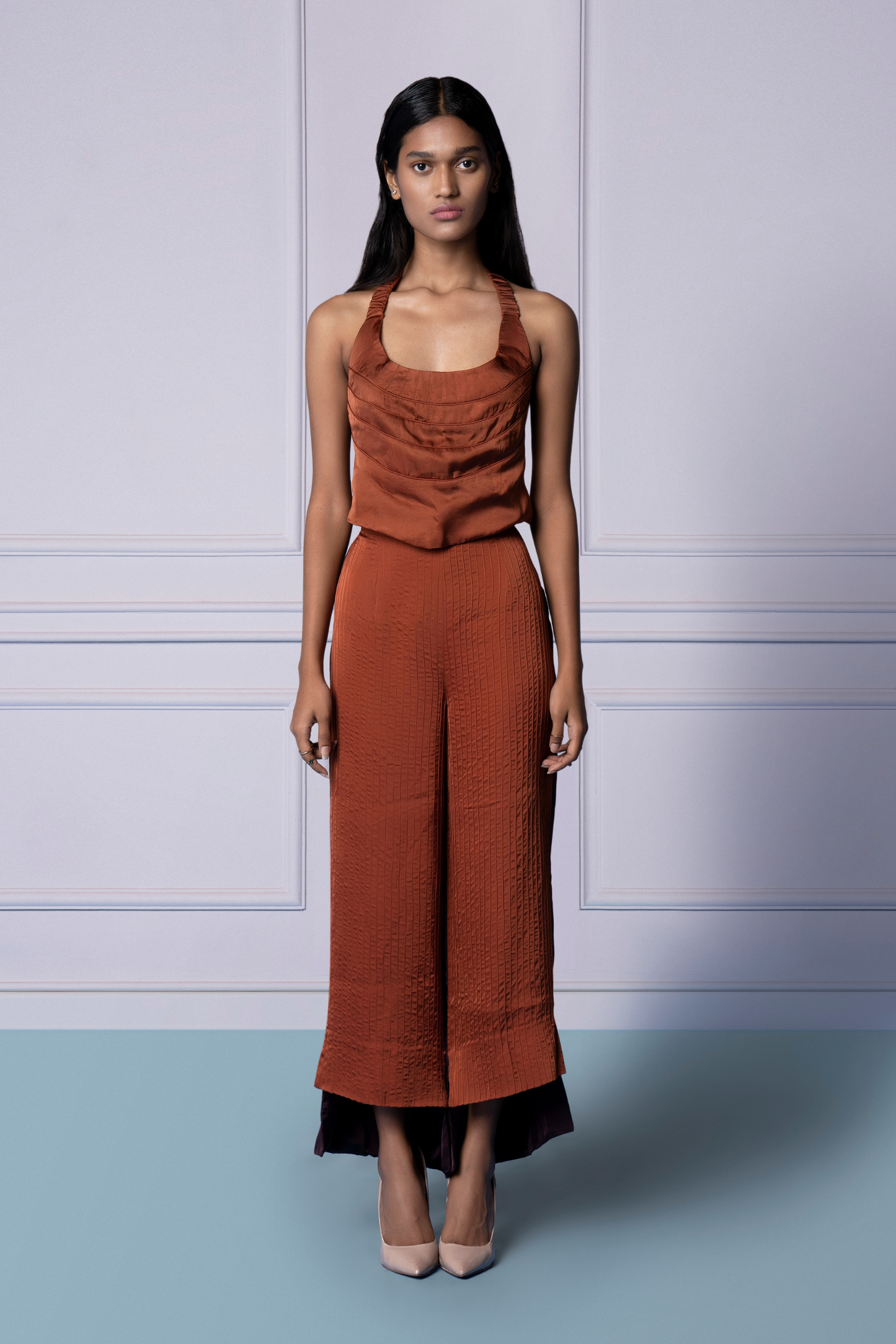 Corset top and pant combination featuring a detailed corset design with sleek tailored pants, a stylish and modern set for women