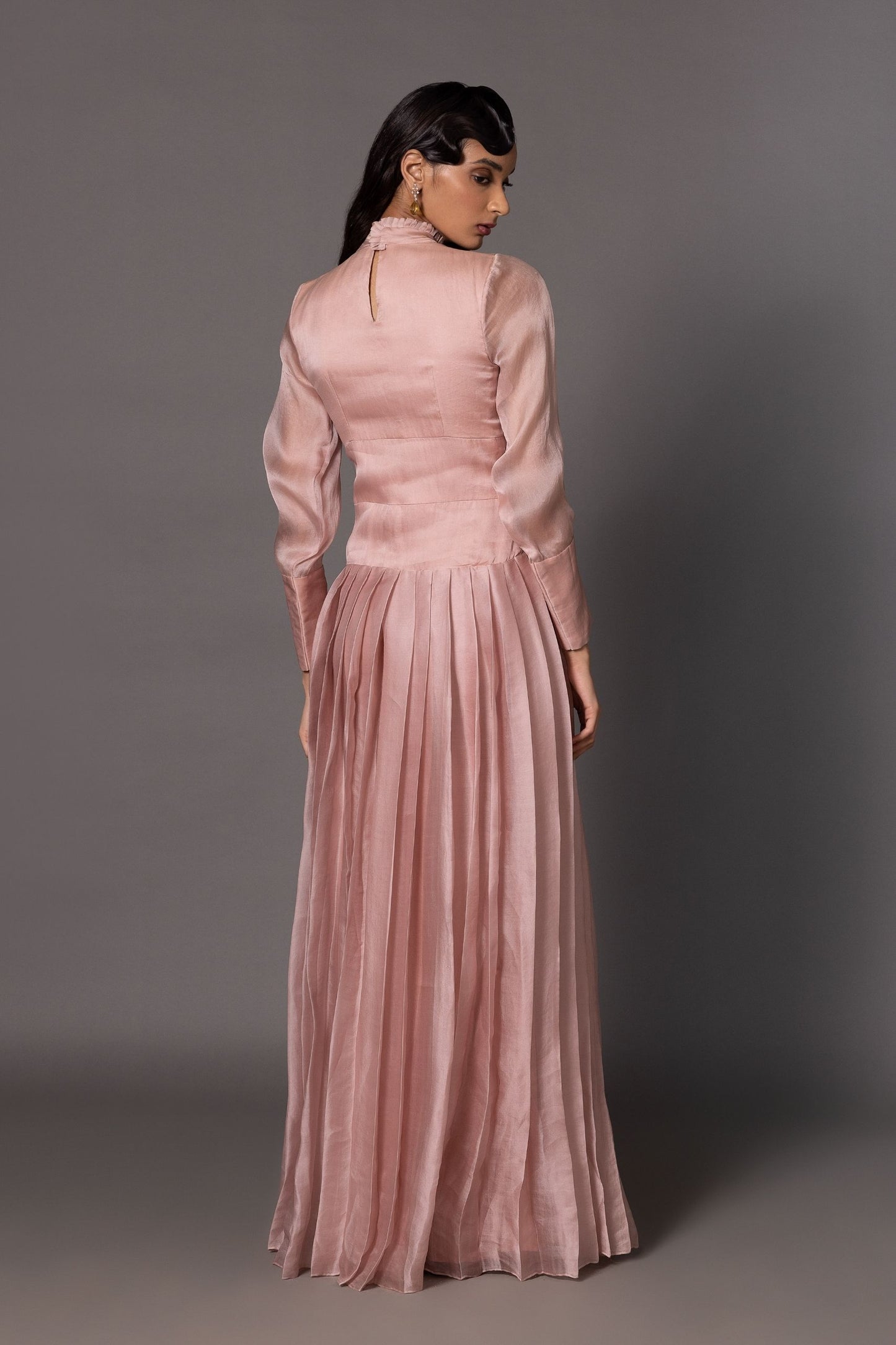 Back View of Victorian Pink Gown - Elegant Fit with Fitted Belt and Pleated Design