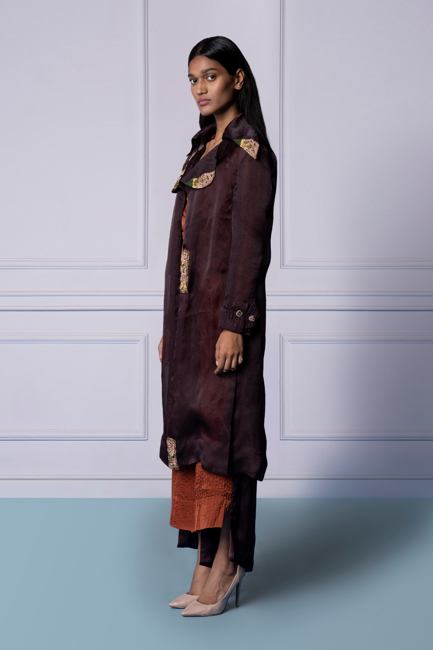 Side view of the Carpet Jacket Set, emphasizing the tailored fit of the embroidered jacket and the stylish corset top