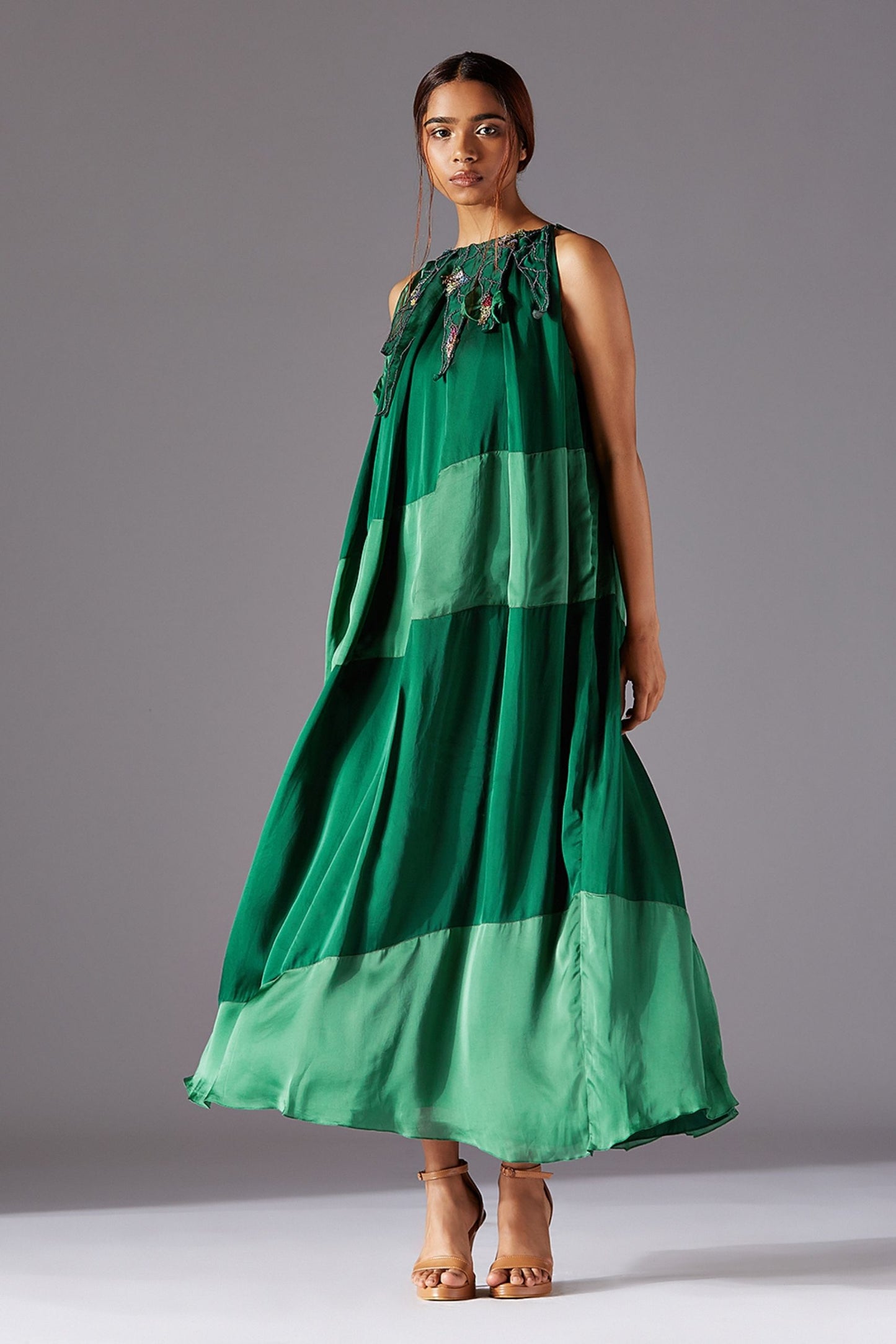 Full-length view of the modern dress, showcasing the box pleats and ankle-length design for a contemporary look