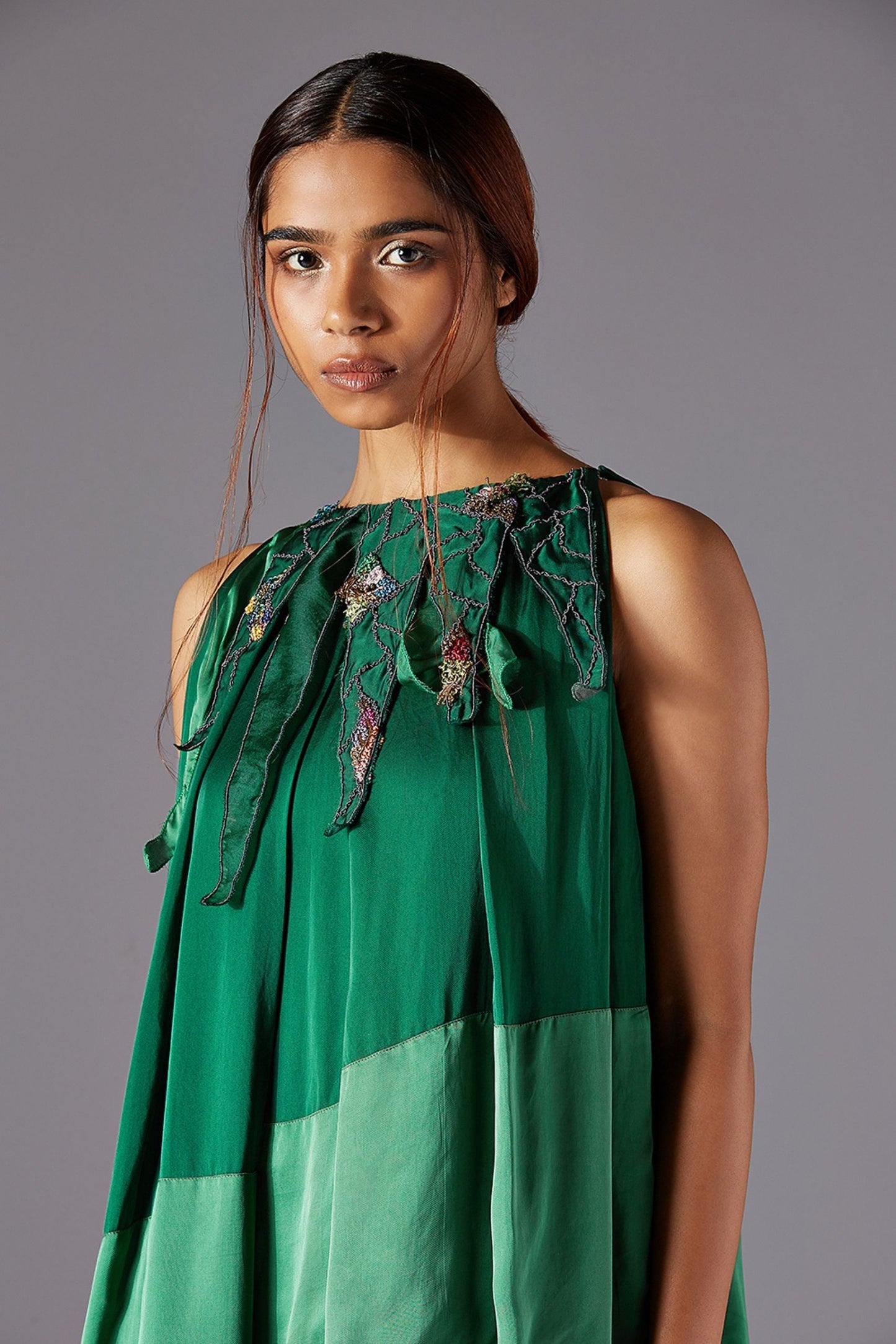 Close-up of the triangular accents and metallic handwork, highlighting the intricate craftsmanship on the stylish dress