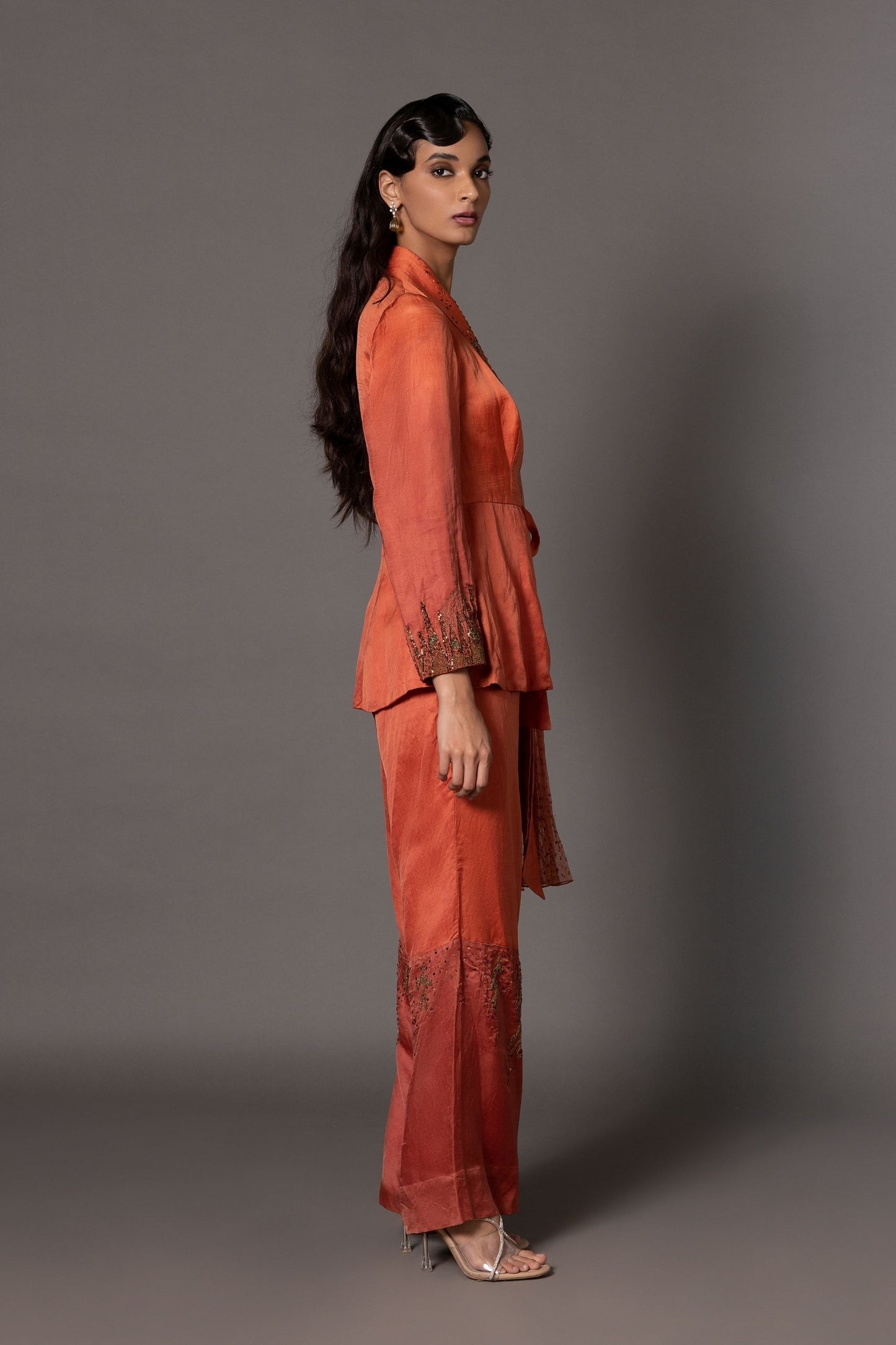 Side View of Beaded Rust Jacket and Trousers Set - Modern Design with Draped Beading