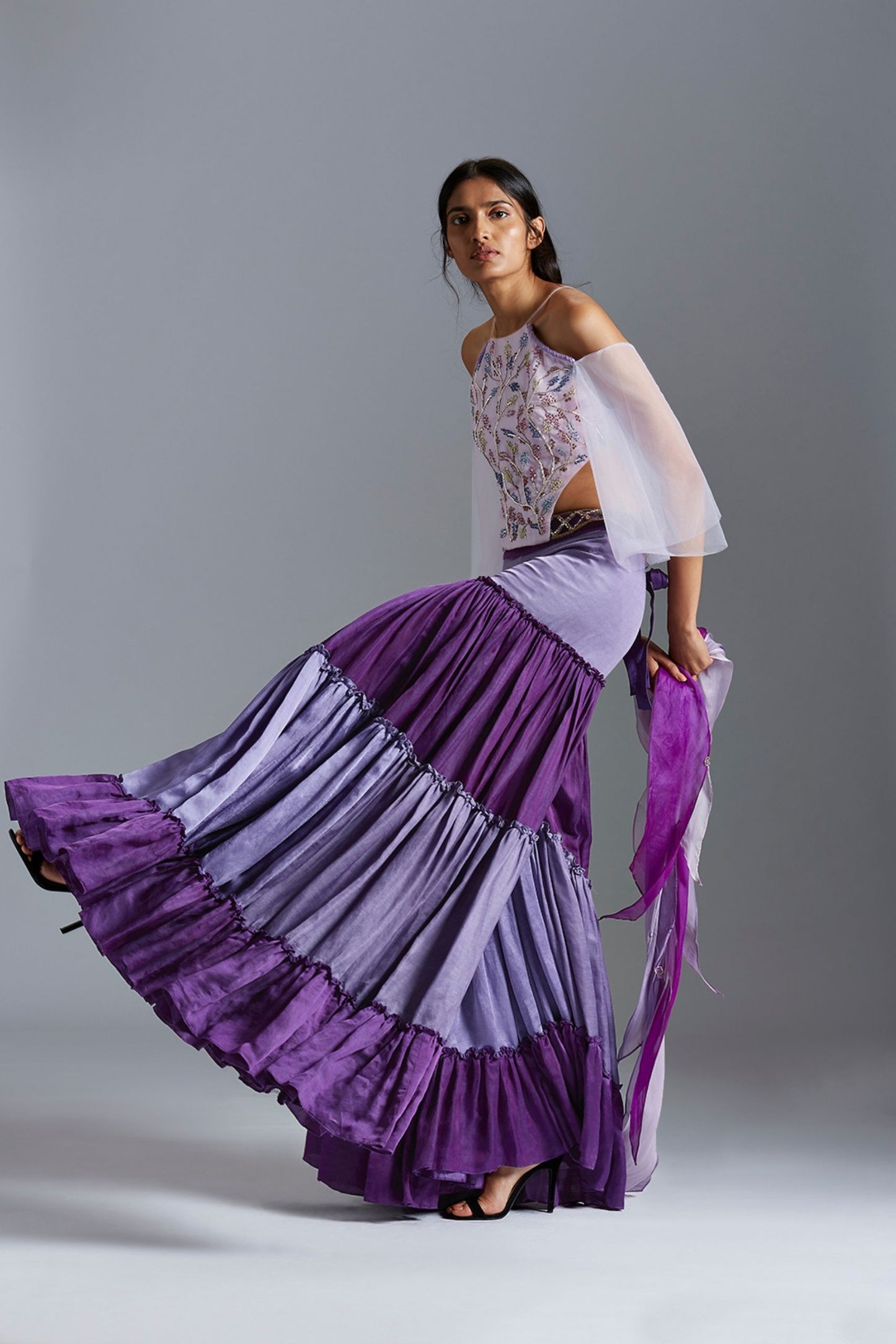 Model wearing the bodysuit blouse with colorblocked sharara dress, exuding a unique and stylish look with French knot embroidery