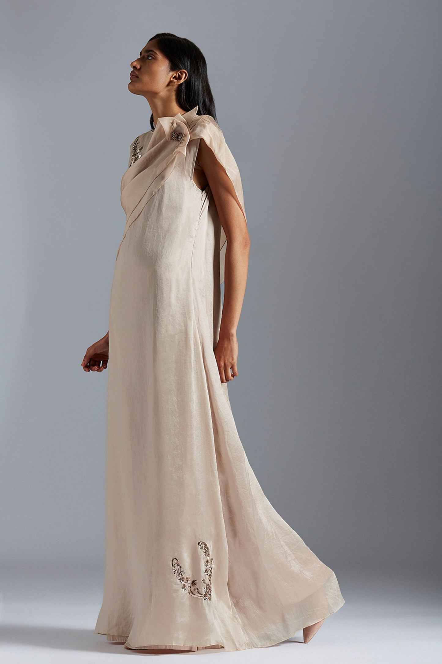 Elegant A-line gown with handmade Mukaish motif and a beaded cape, designed for women’s formal events
