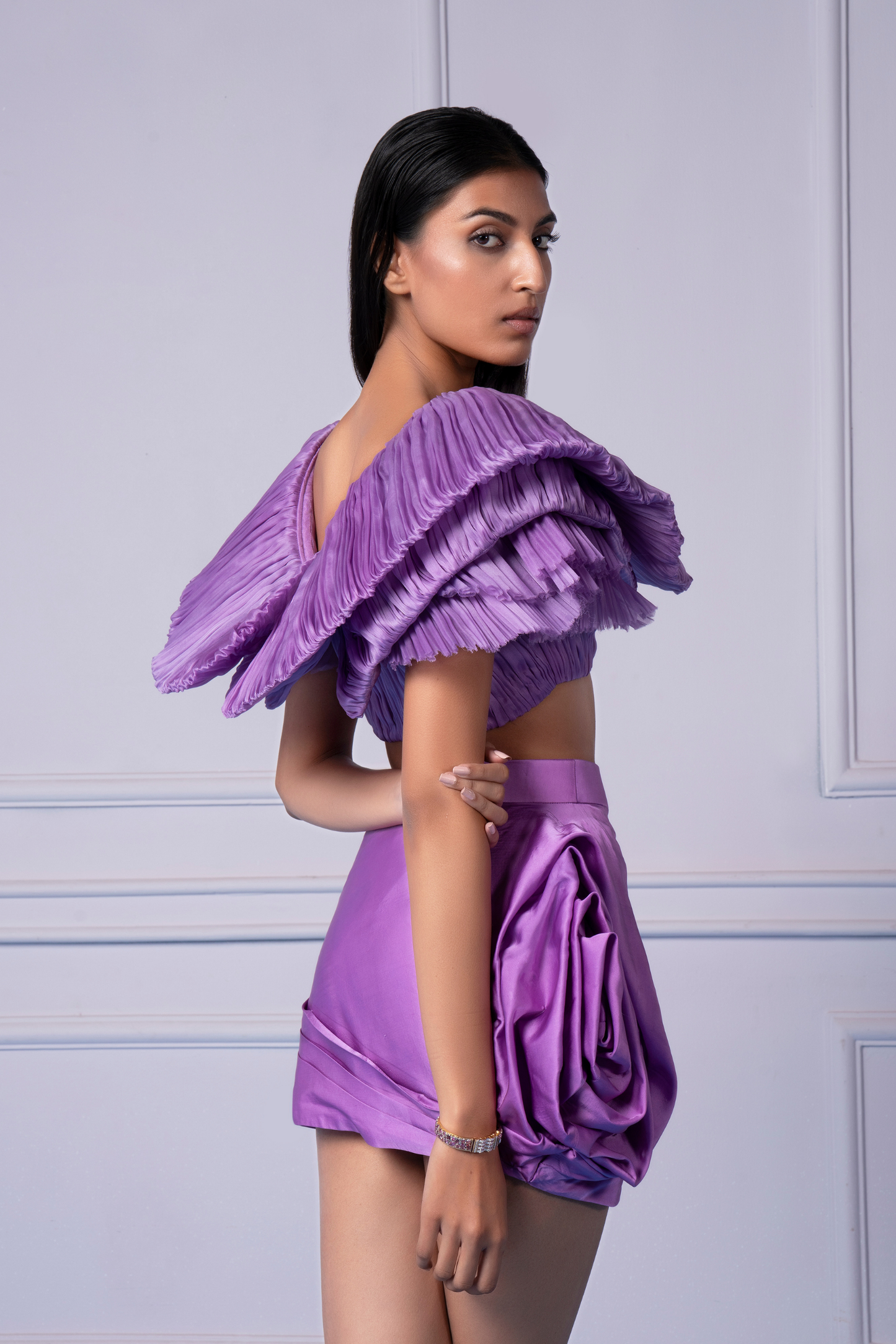 Woman confidently wearing the party wear skirt and crop top, a perfect outfit for special occasions