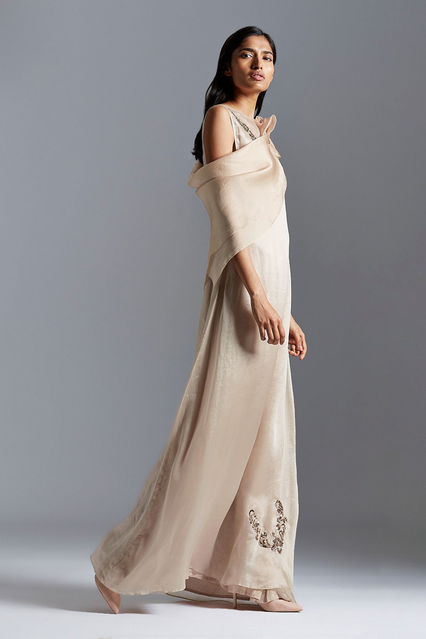 Side profile of the A-line gown with Mukaish embroidery and beaded cape, showcasing the flattering silhouette