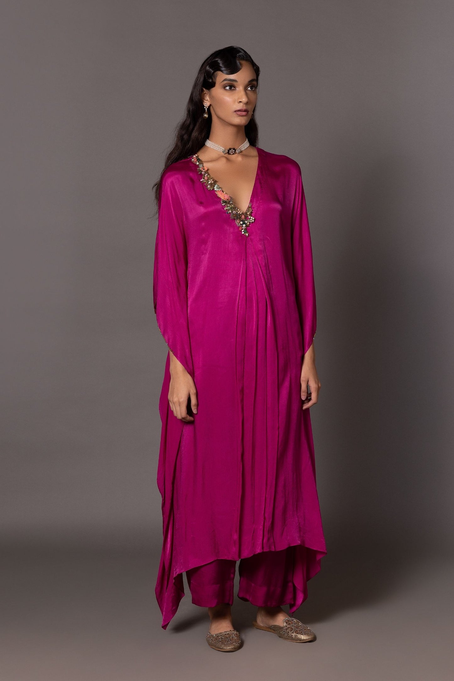 Iris Kurta Set with asymmetric embroidered details and straight trousers, showcasing a stylish and elegant designer kurta set for women