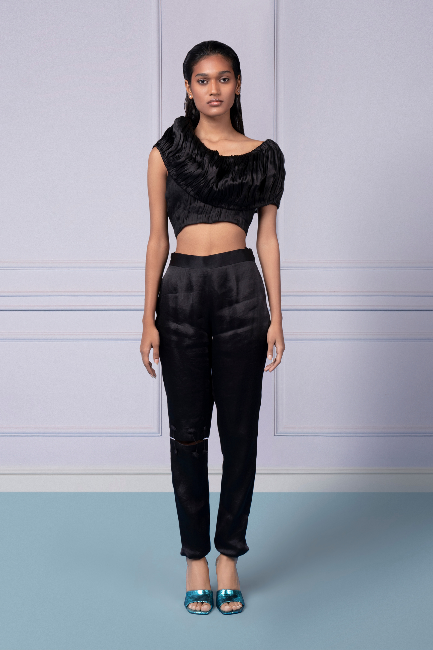 Stylish black crop top with hand-ruched satin design and chic black pants with cut-out details for women