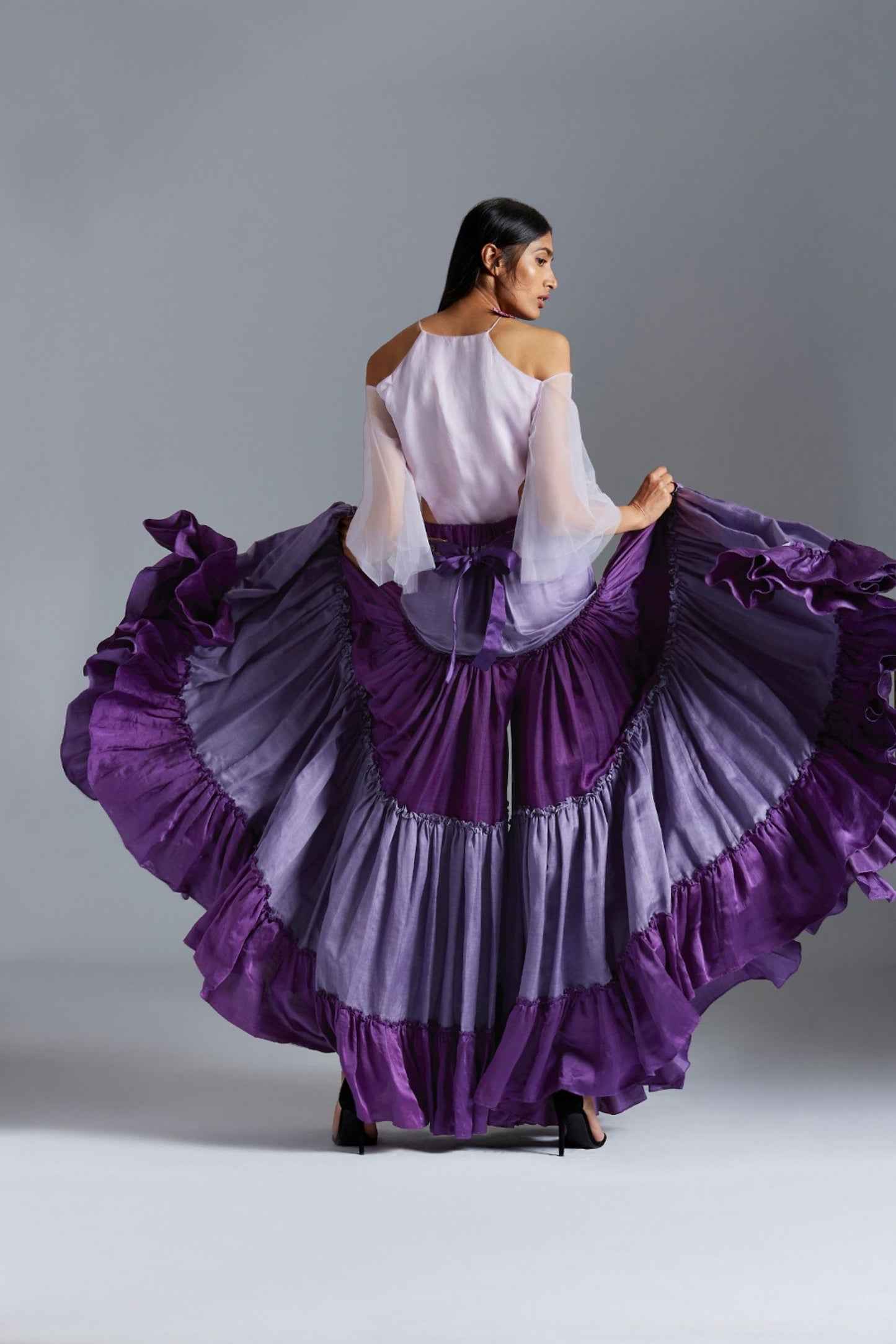 Back view of the bodysuit blouse with sharara dress, showing the sleek fit and design