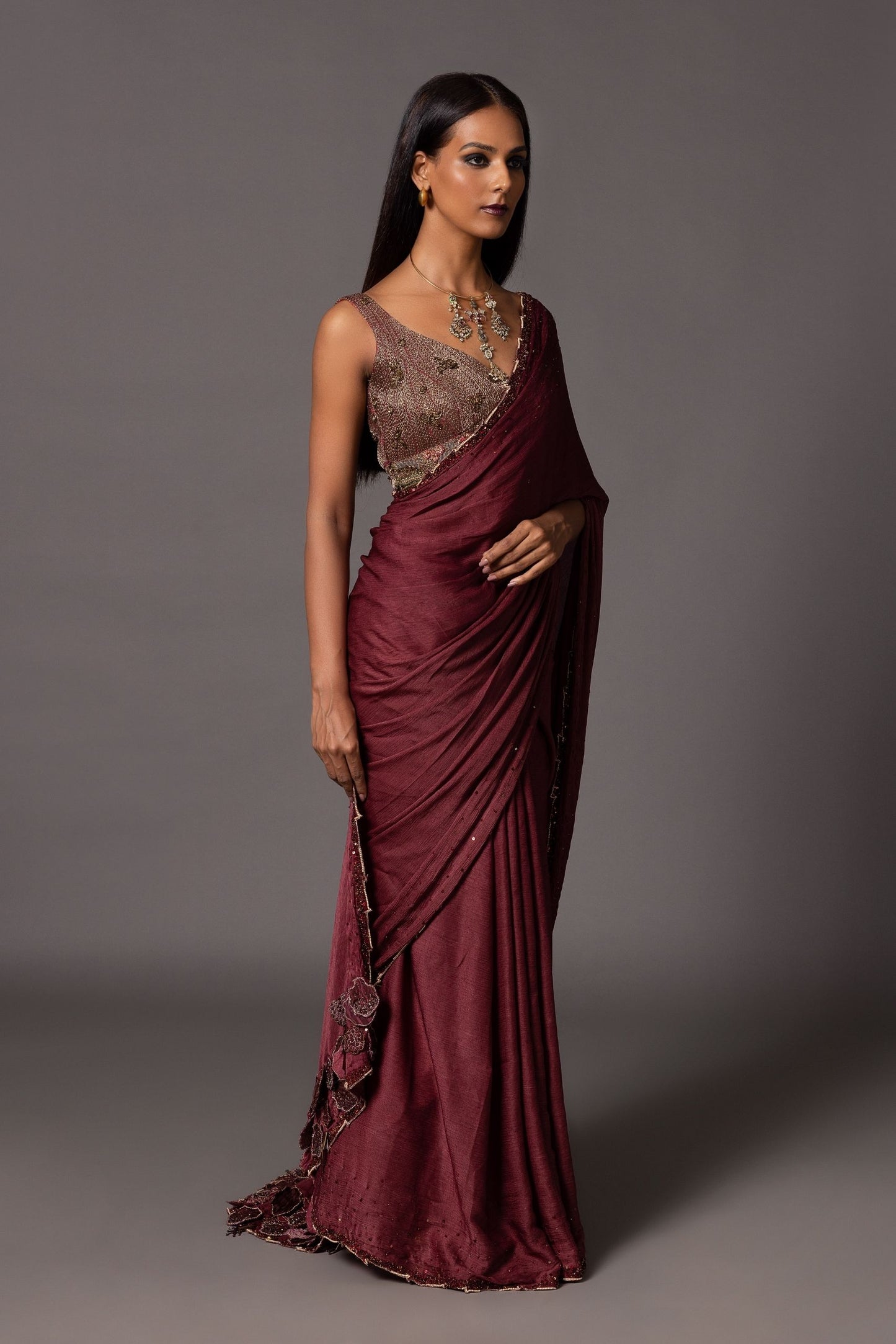 Full view of the Namib Maroon Sequin Sari, showcasing the entire design with a metallic blouse and intricate sequin details