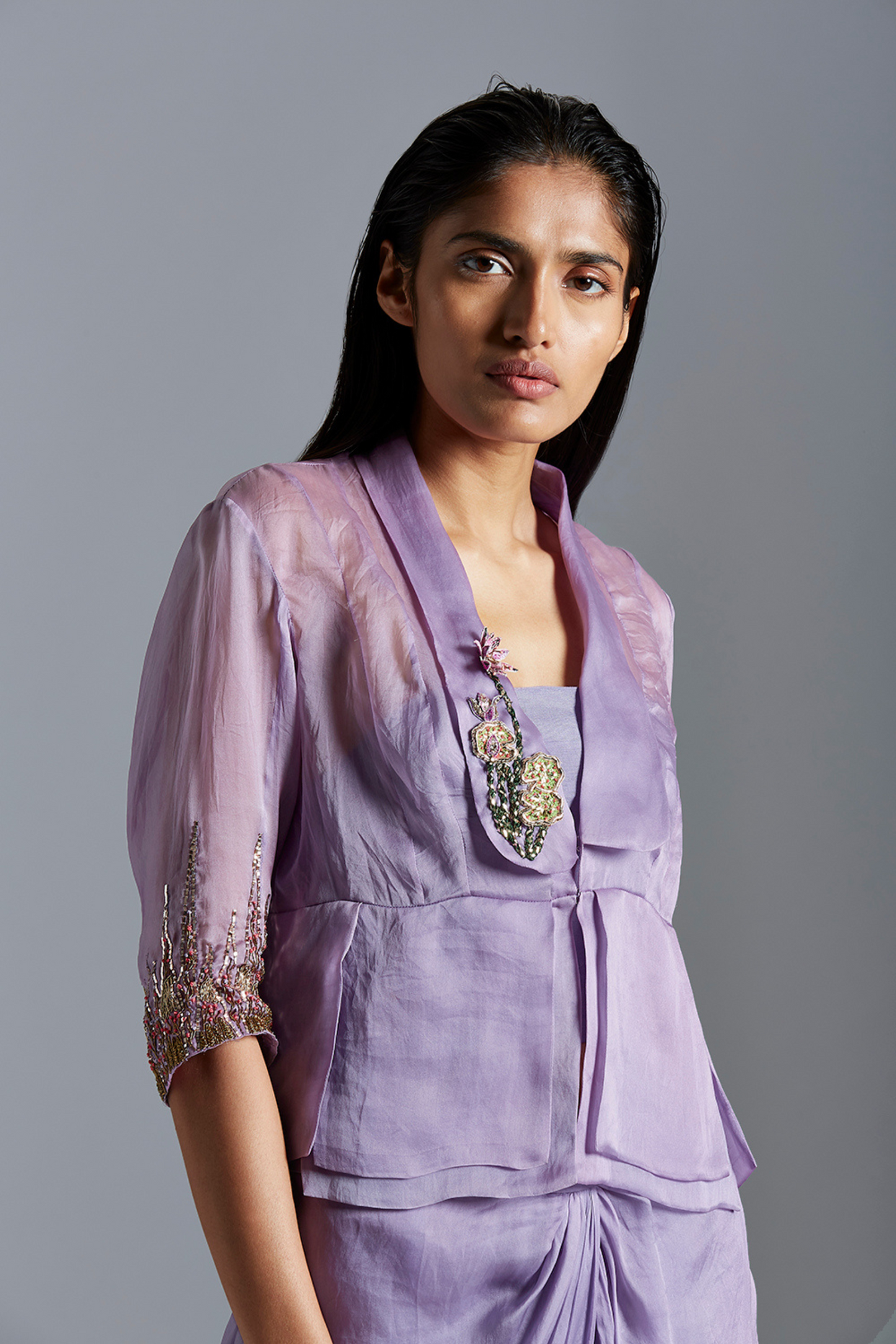 Focused view on the intricate mukaish embroidery on the top, capturing the delicate and detailed handiwork