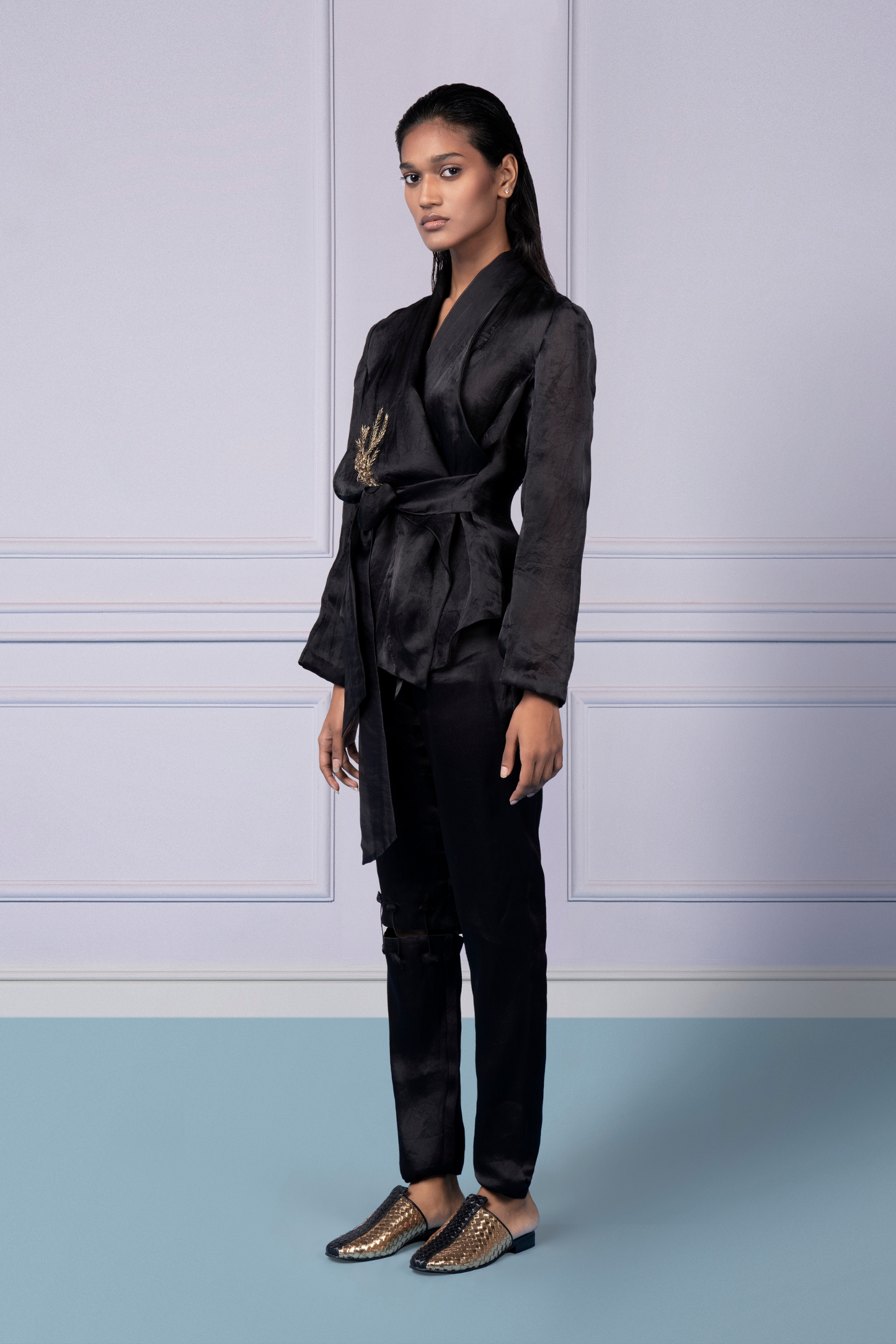 Iconic jacket and pants for women featuring a wrap organza jacket with embellishments and narrow pants with knee cutouts