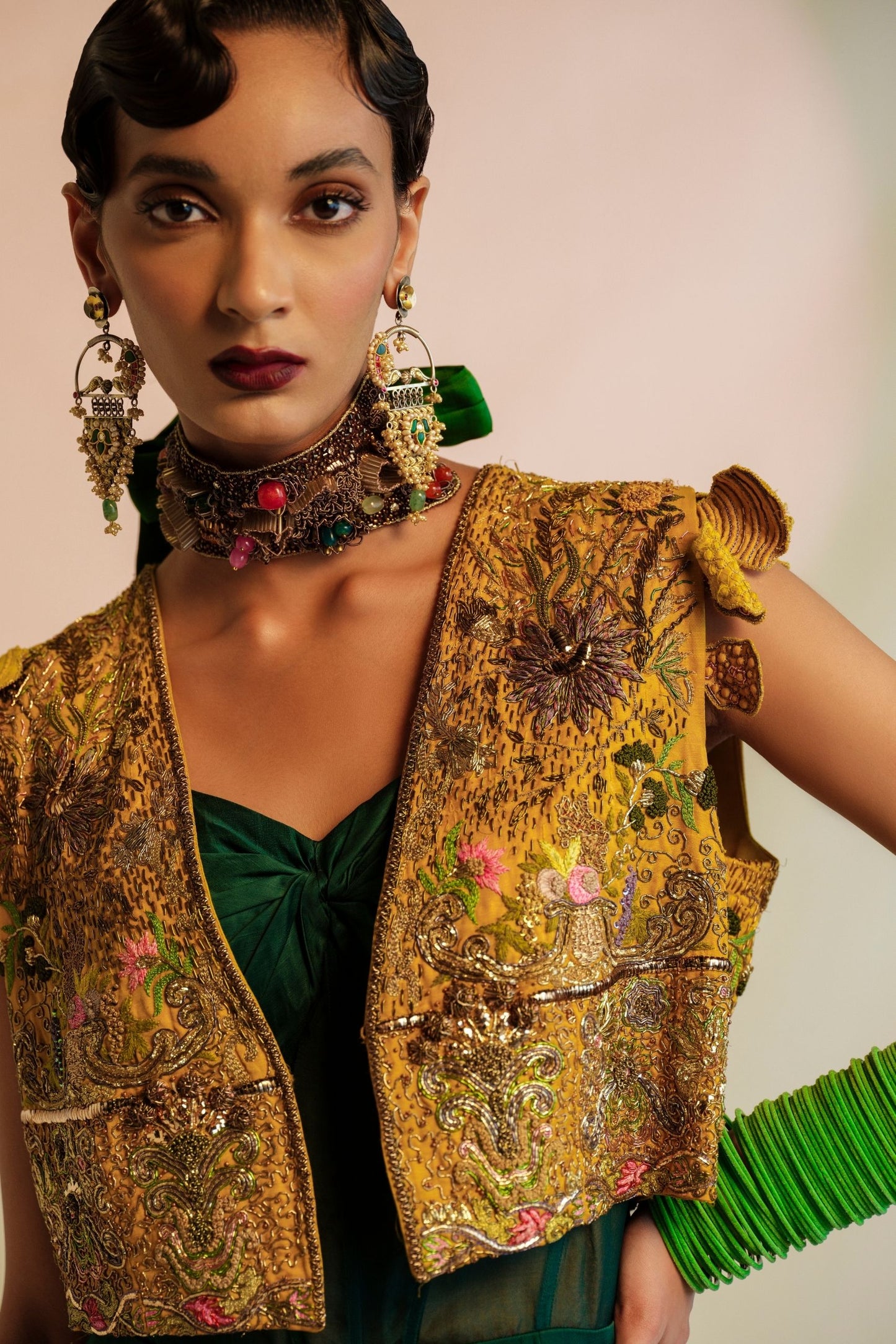 Close-up of the Zardosi handwork on the Paro Cropped Embroidered Jacket paired with the Namib Bottle Green Jumpsuit