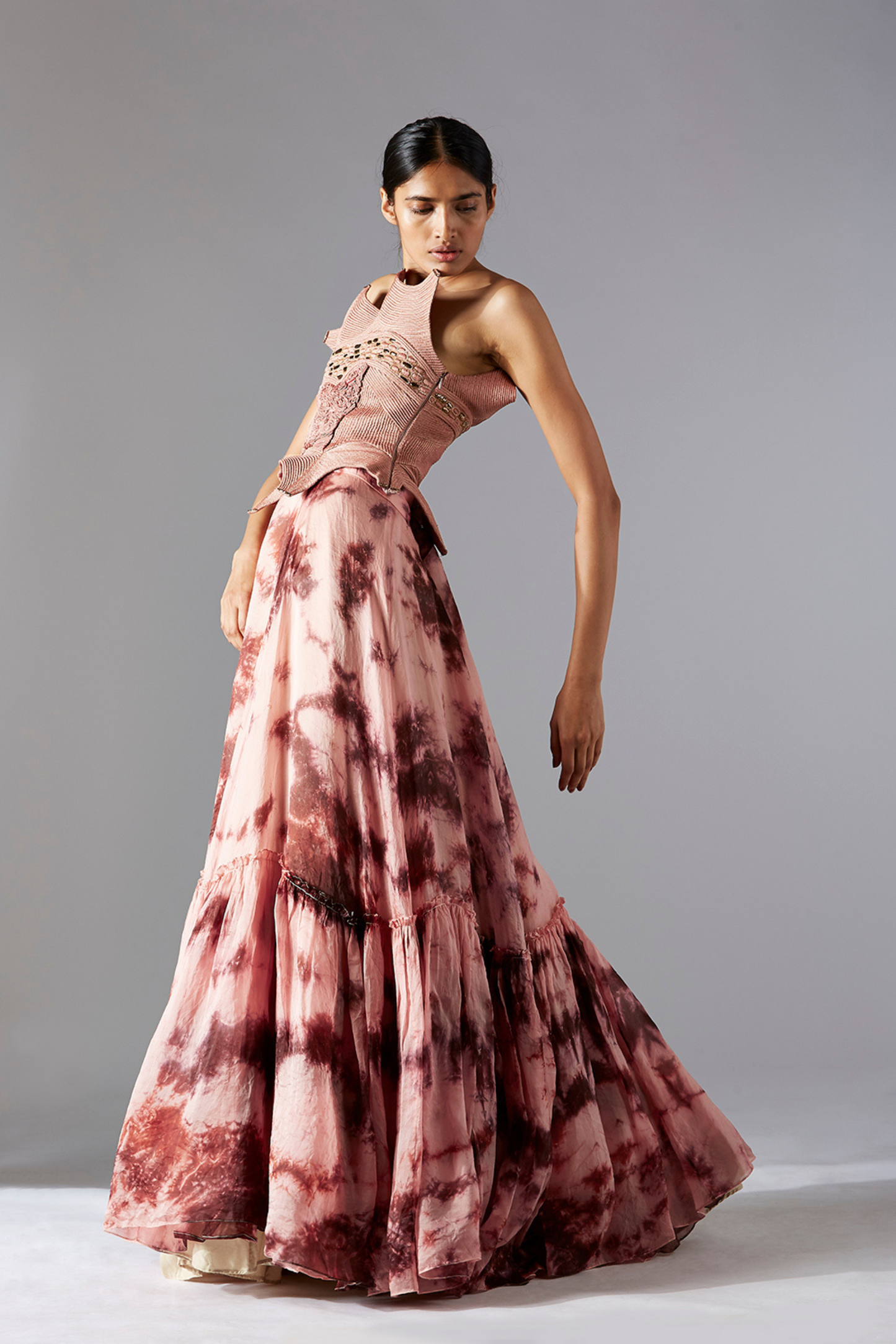 Side view of the corset and flared batik skirt set, showcasing the detailed corset and flow of the skirt