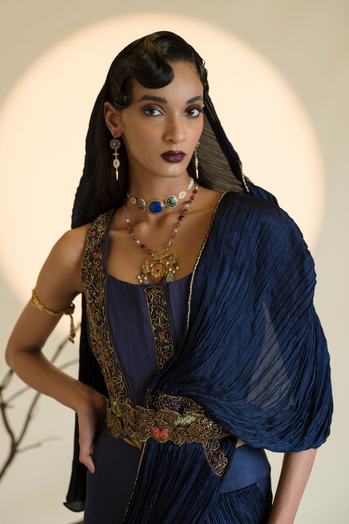 Close-up view of the 3D animal motifs and metallic embroidery on Shikharbaugh Navy Blue Lehenga