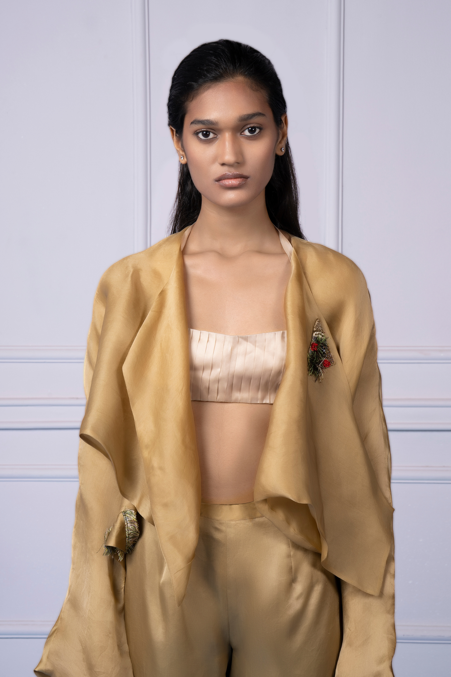 Close-up of the handmade embroidery on the Misfit jacket and the delicate organza fabric of the pants