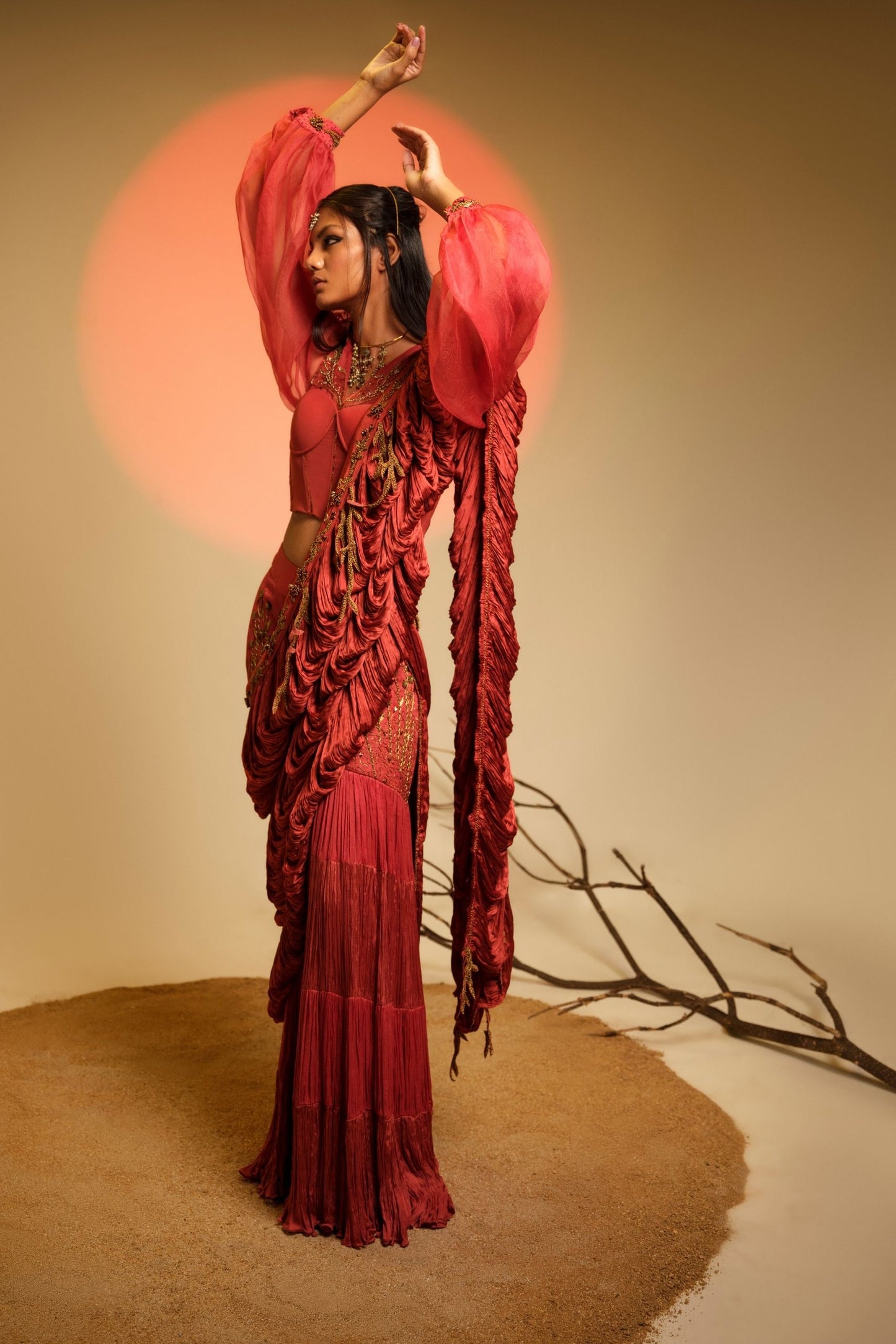 Model Wearing Elegant Sari, Corset Blouse & Skirt Set for Women with Red Chiffon Sari and Layered Skirt