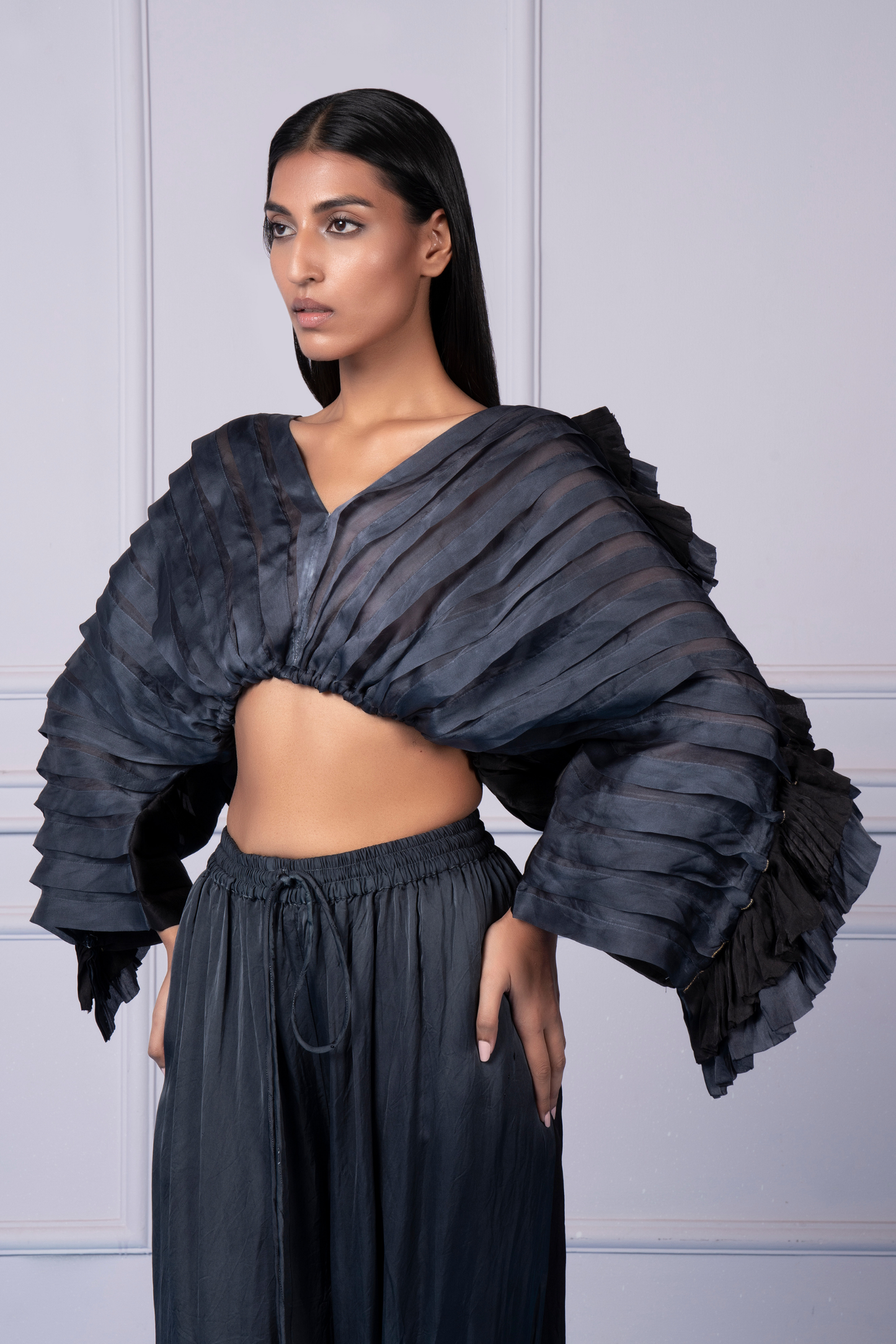 Close-up of the slit openings and pleated texture of the Mushroom top and joggers