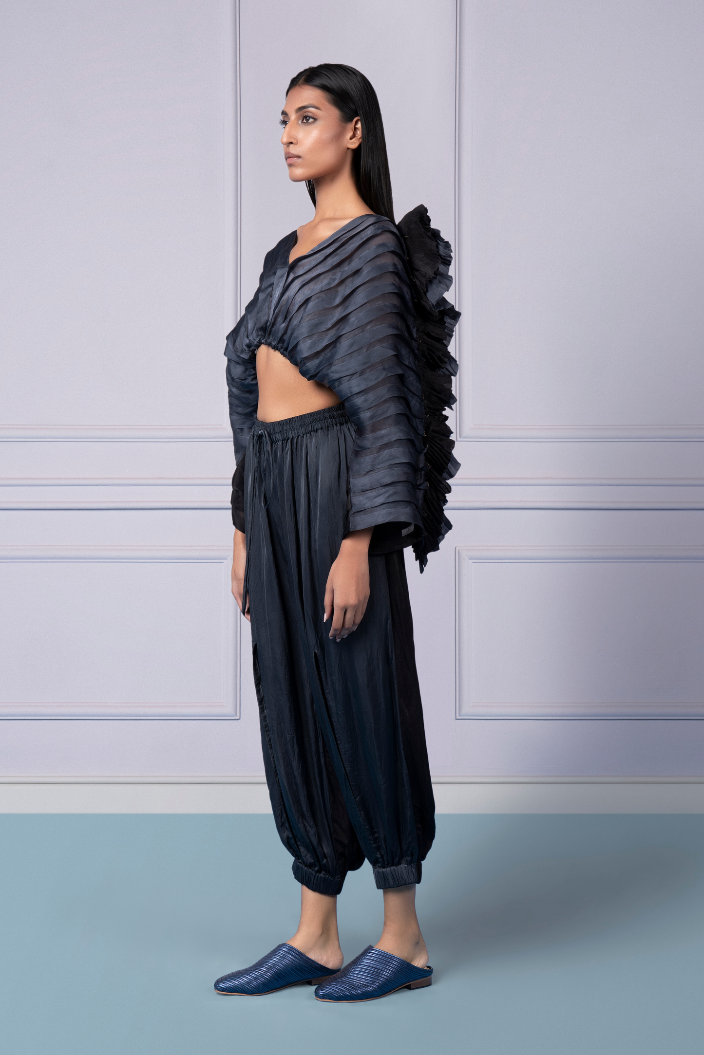 Mushroom pleated satin organza top paired with classic joggers with slit openings and elastic waist