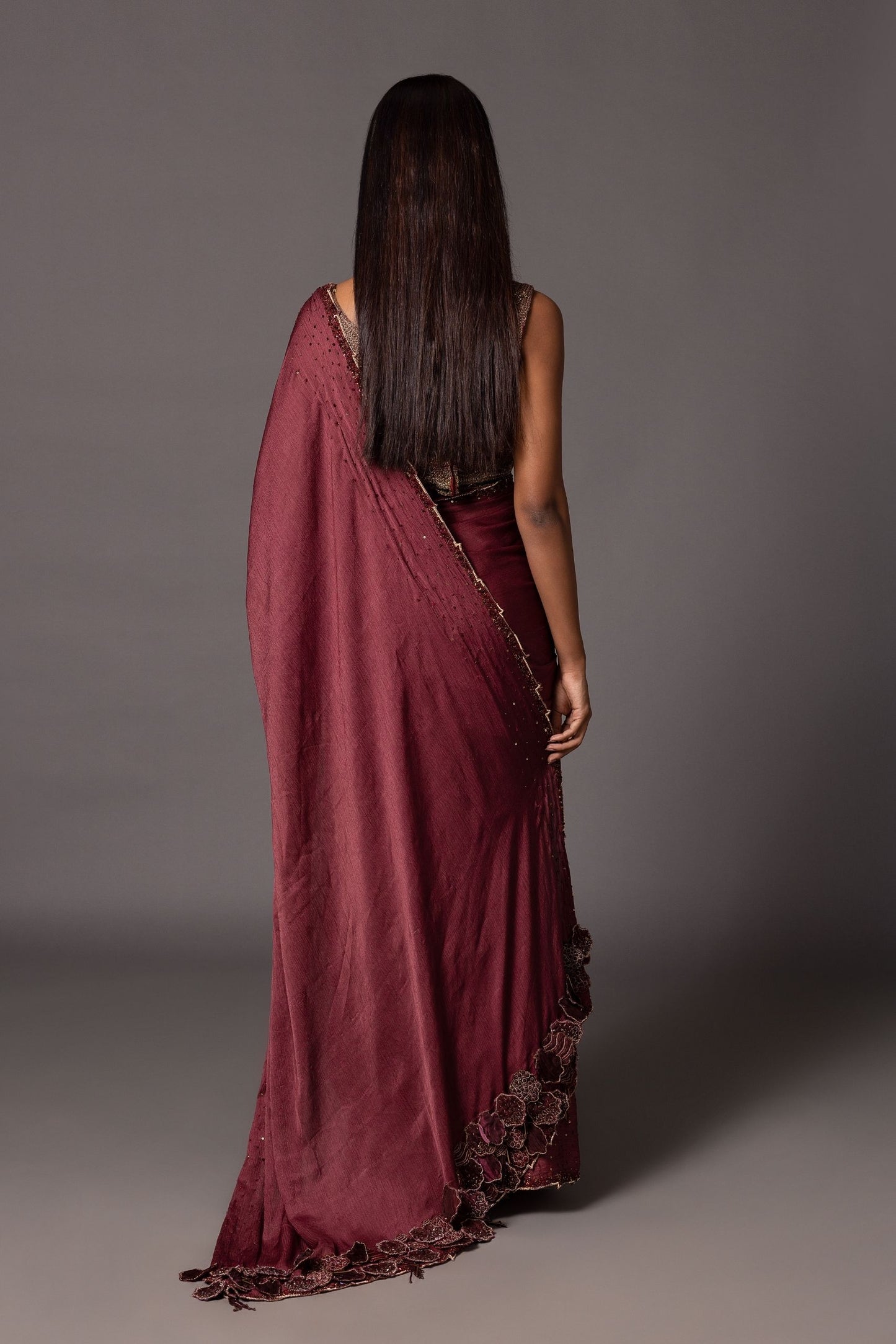 Back view of the Namib Maroon Sequin Sari featuring the metallic blouse and elegant design details
