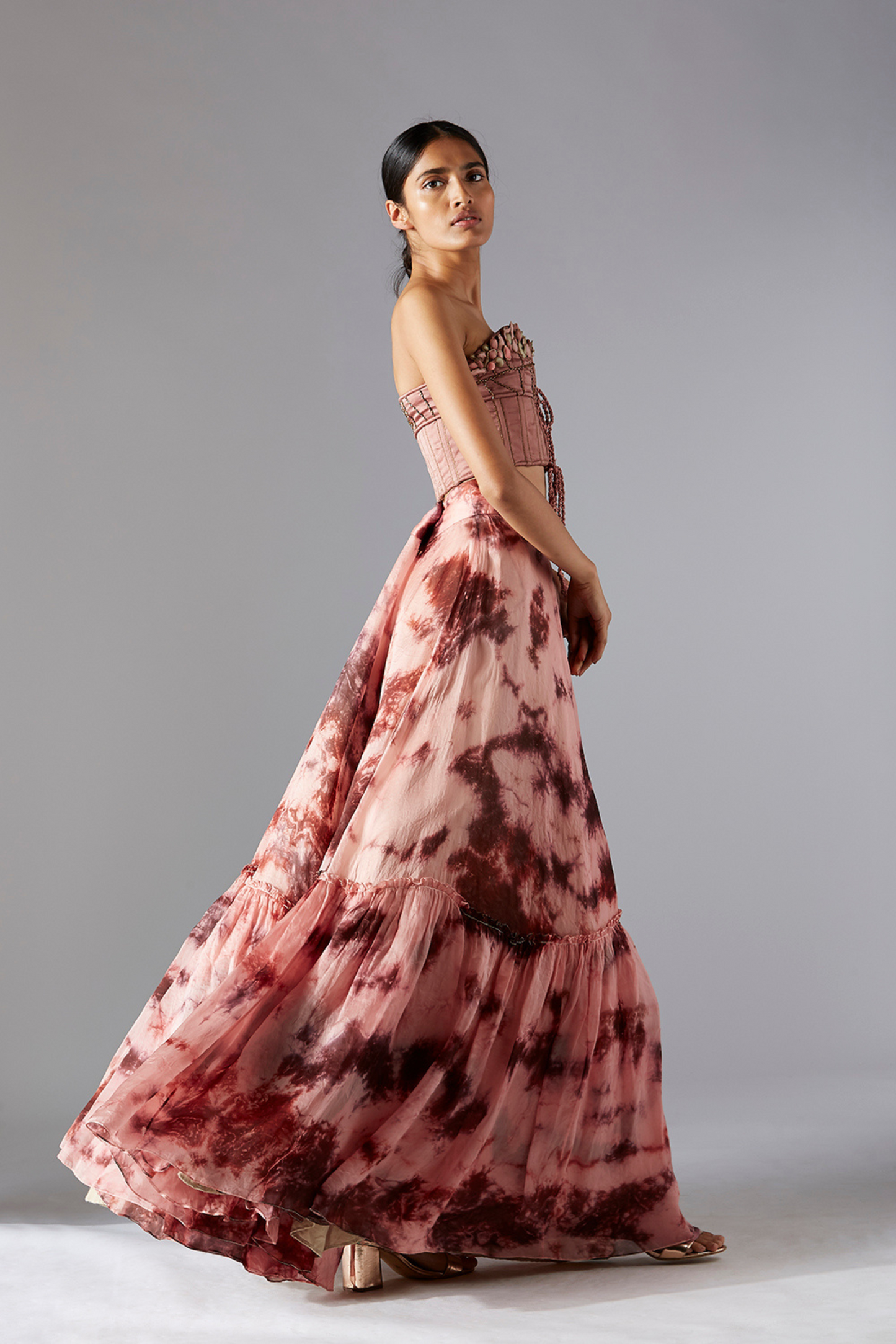 Side view of the stylish top skirt set, showcasing the corset top and the flowy batik skirt