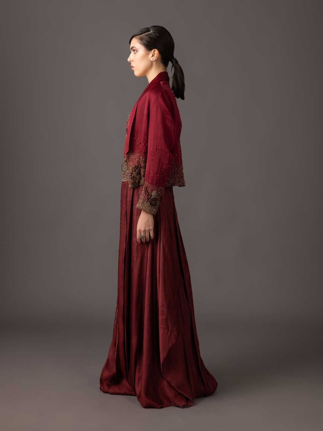 Side View of Maroon Tuxedo Jacket & Corset Gown - Elegant Pleated Skirt and Luxury Design