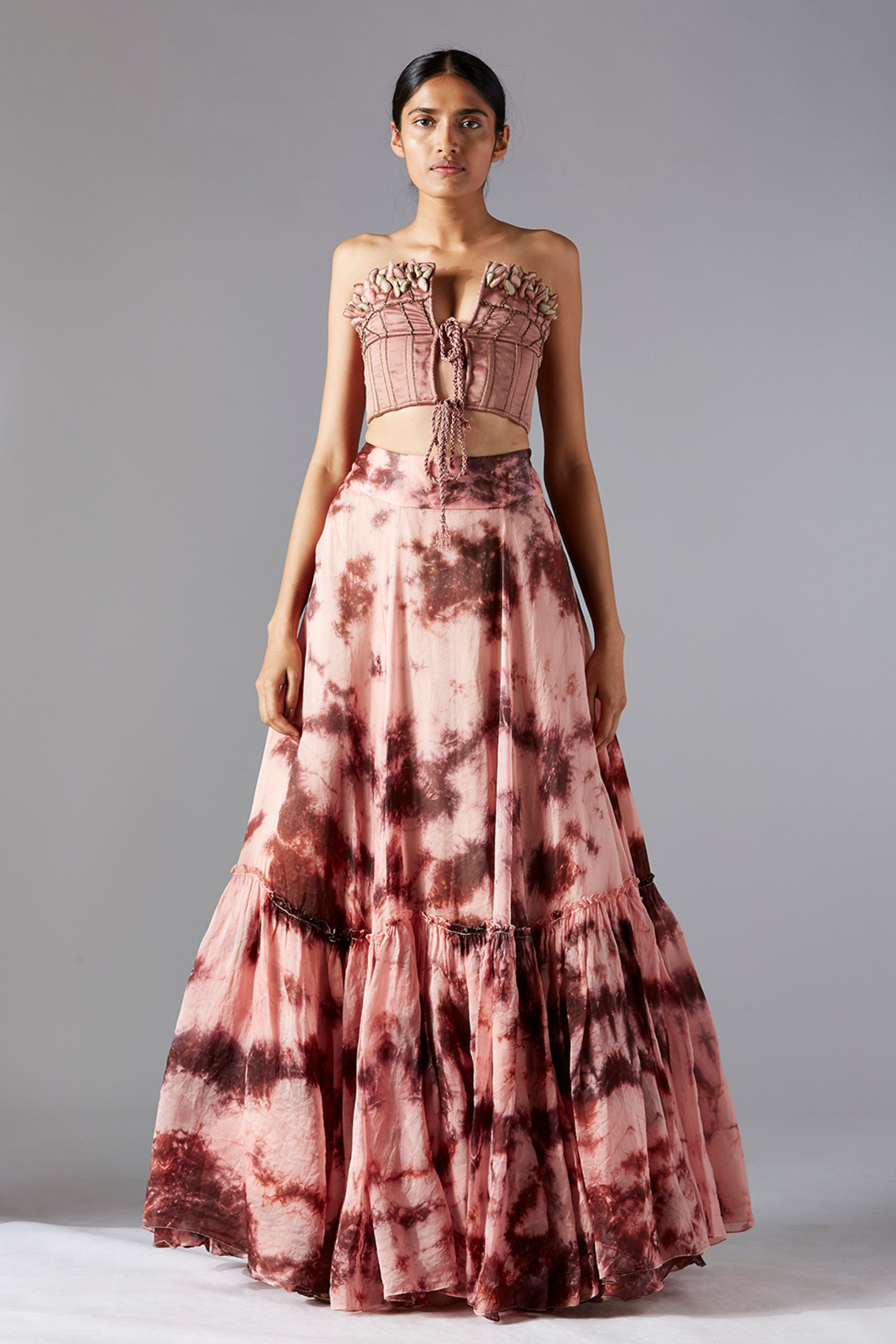Stylish top skirt set for women featuring a corset-style top with maze embroidery and a flared batik skirt, modern and chic design