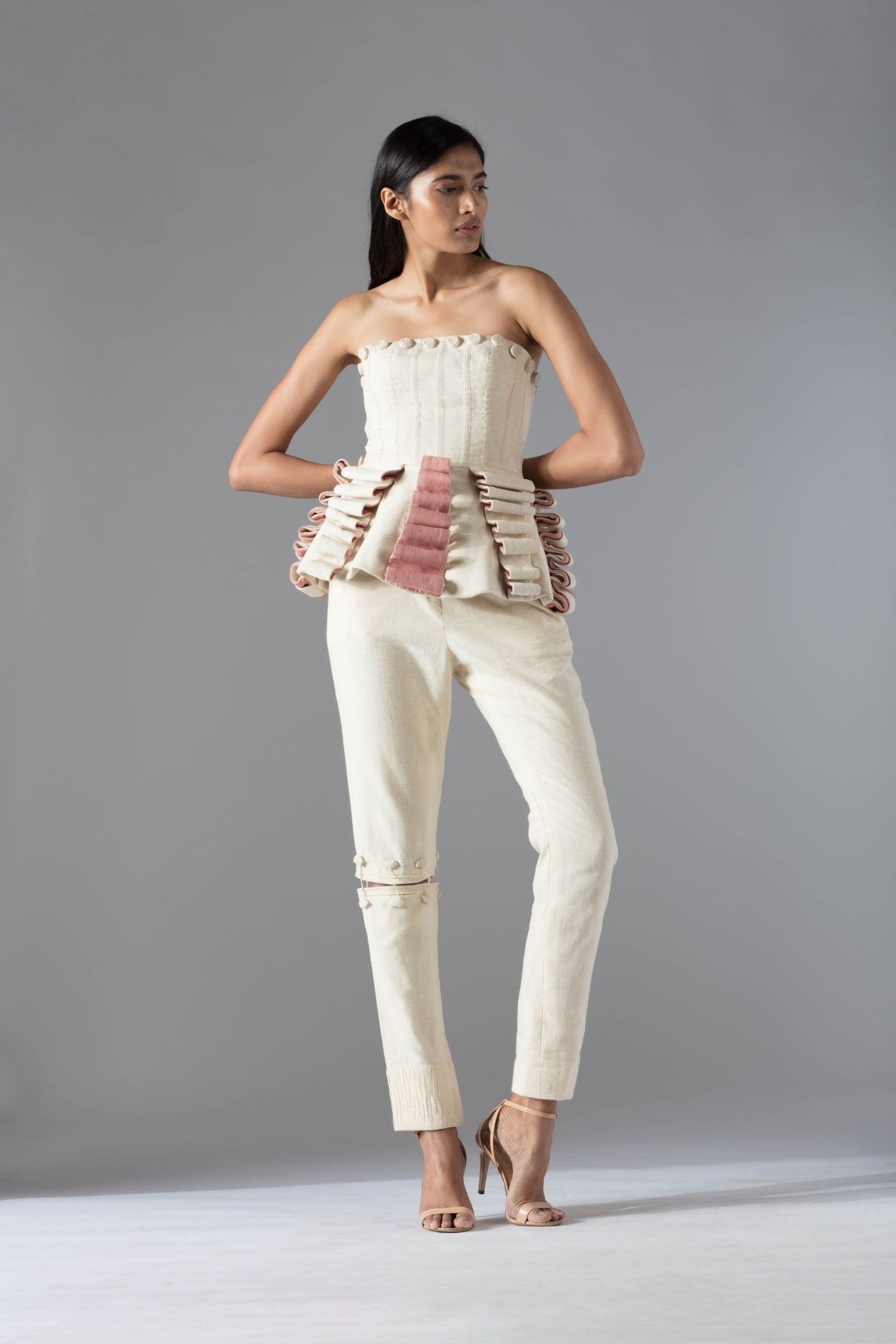 Stylish peplum-style designer top for women, crafted in organic khadi with handmade rose details for a modern and elegant look