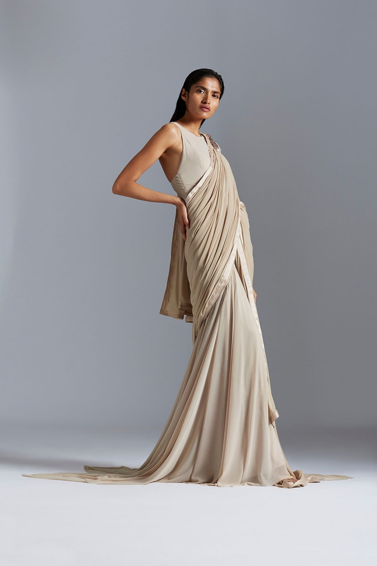 Icicle gown saree with intricate handmade beadwork, showcasing a blend of traditional sari and modern gown styles