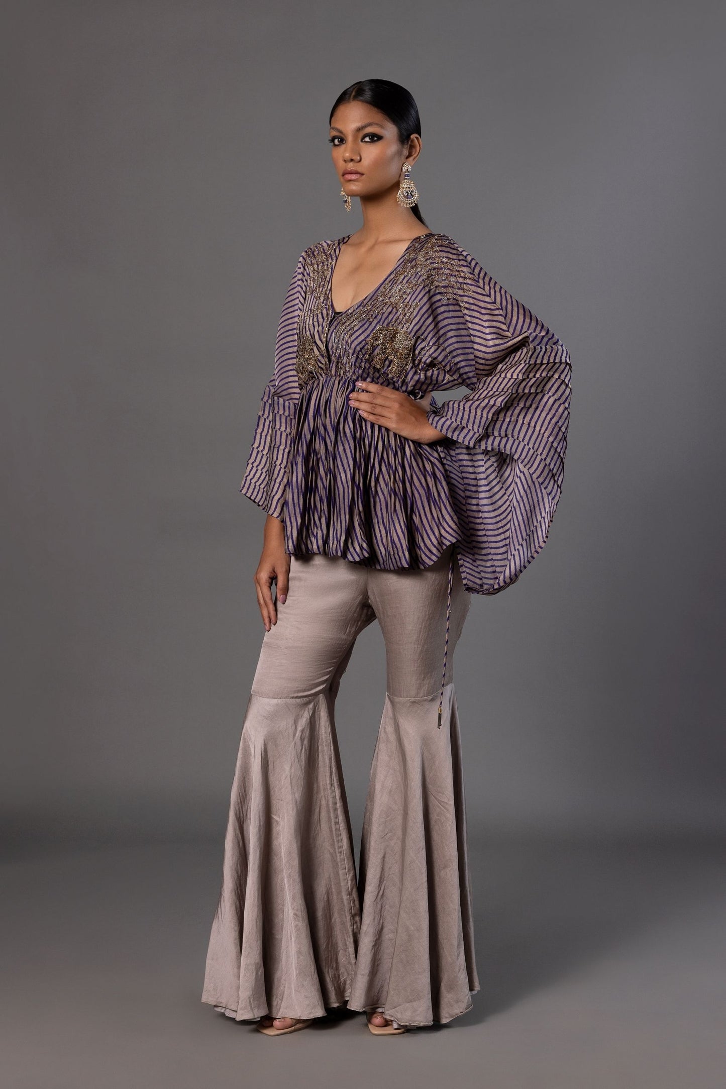 Shikhar Baugh Women's Peplum Top with metallic embroidery and grey gharara set featuring animal, tree, and floral motifs