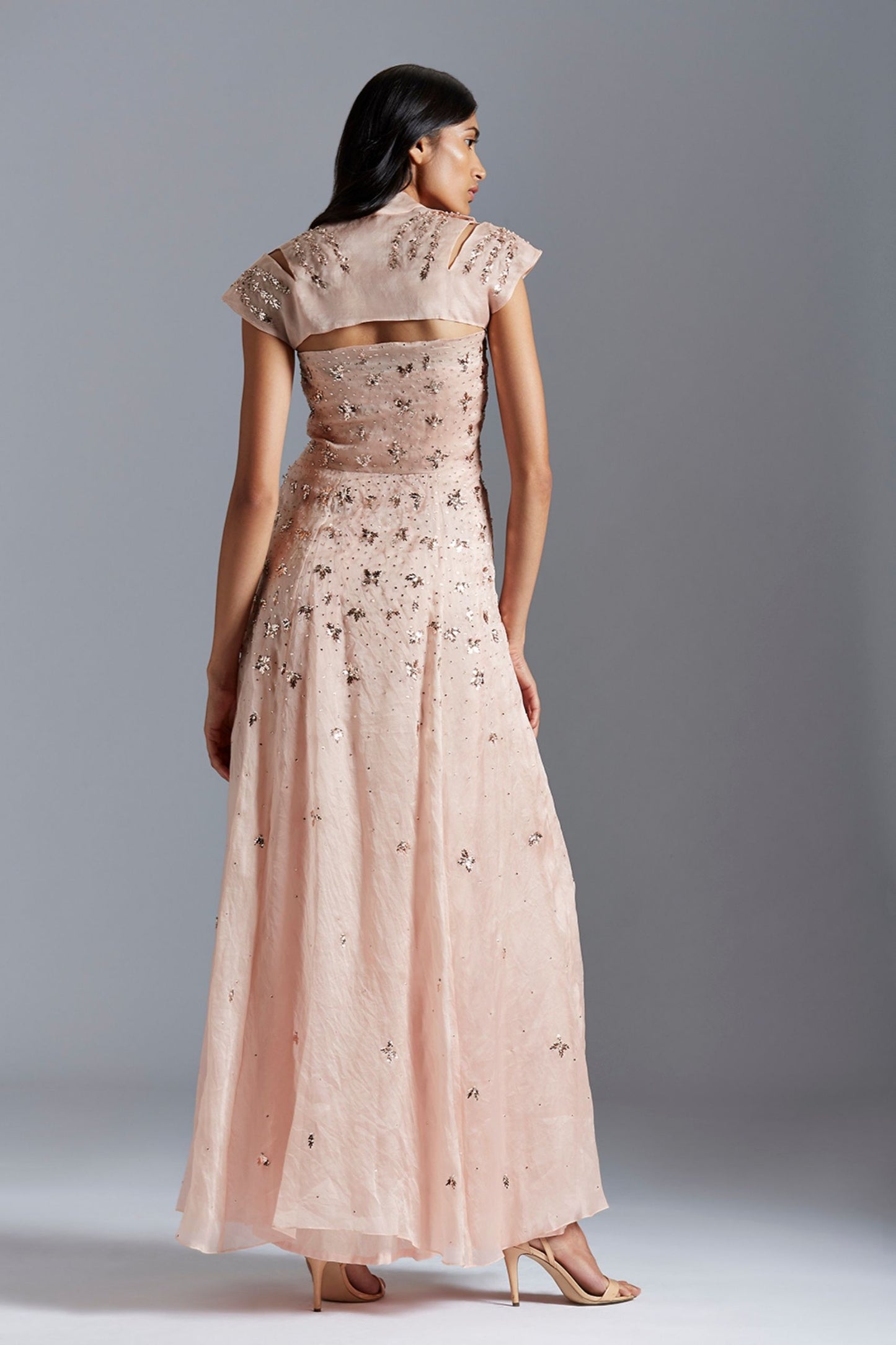 Back view of the gown, emphasizing the flawless fit and luxurious satin organza fabric