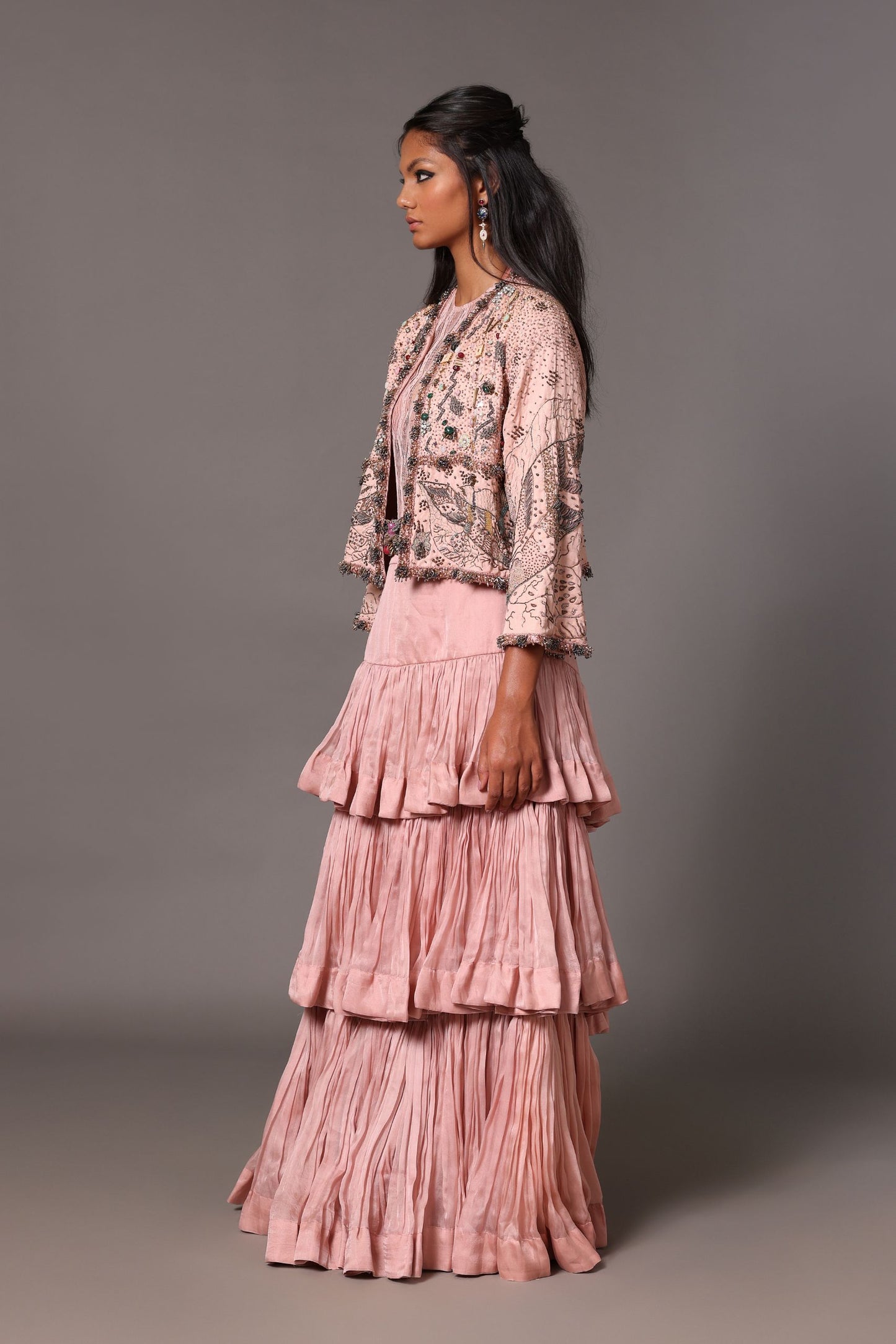 Side view of the Sang-e-Sitara Pink Jacket and Lehenga Skirt Set, showing the silhouette and the flow of the lehenga skirt