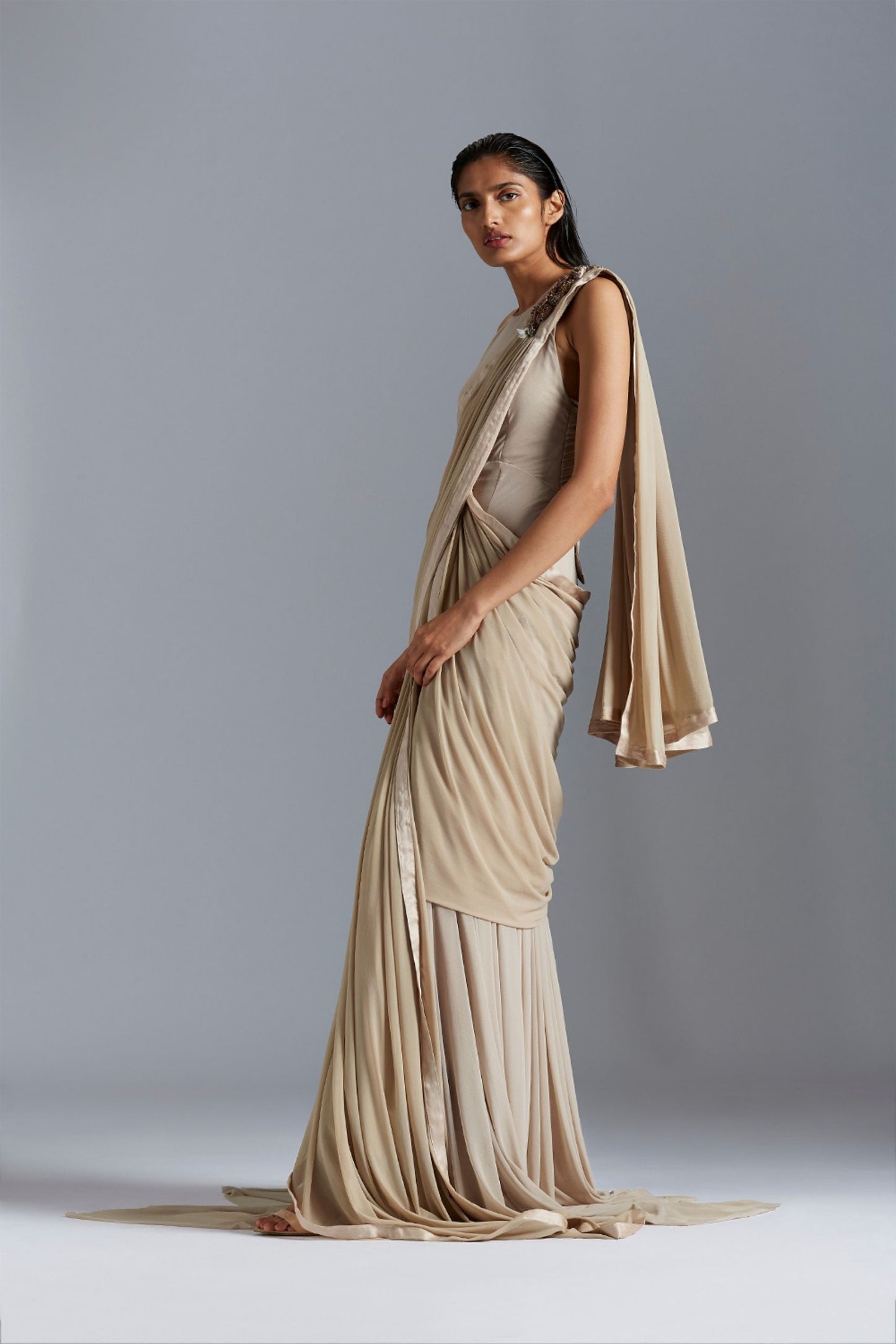 Side profile of the Icicle gown saree, emphasizing the elegant drape and bead embroidery details
