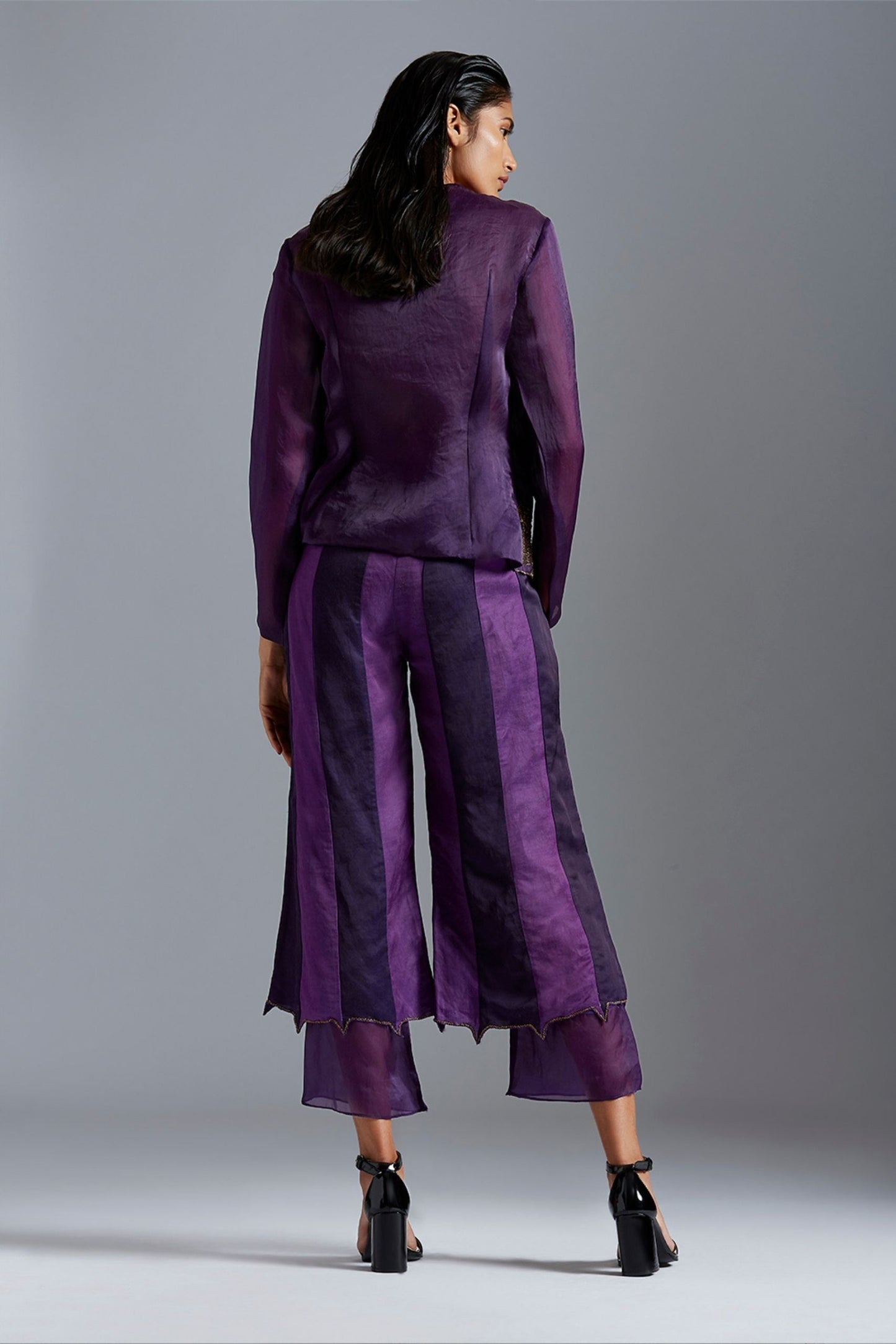 Back view of the pant and top set, emphasizing the detailed metallic embroidery on the Angarakha coat and the sleek design of the pants