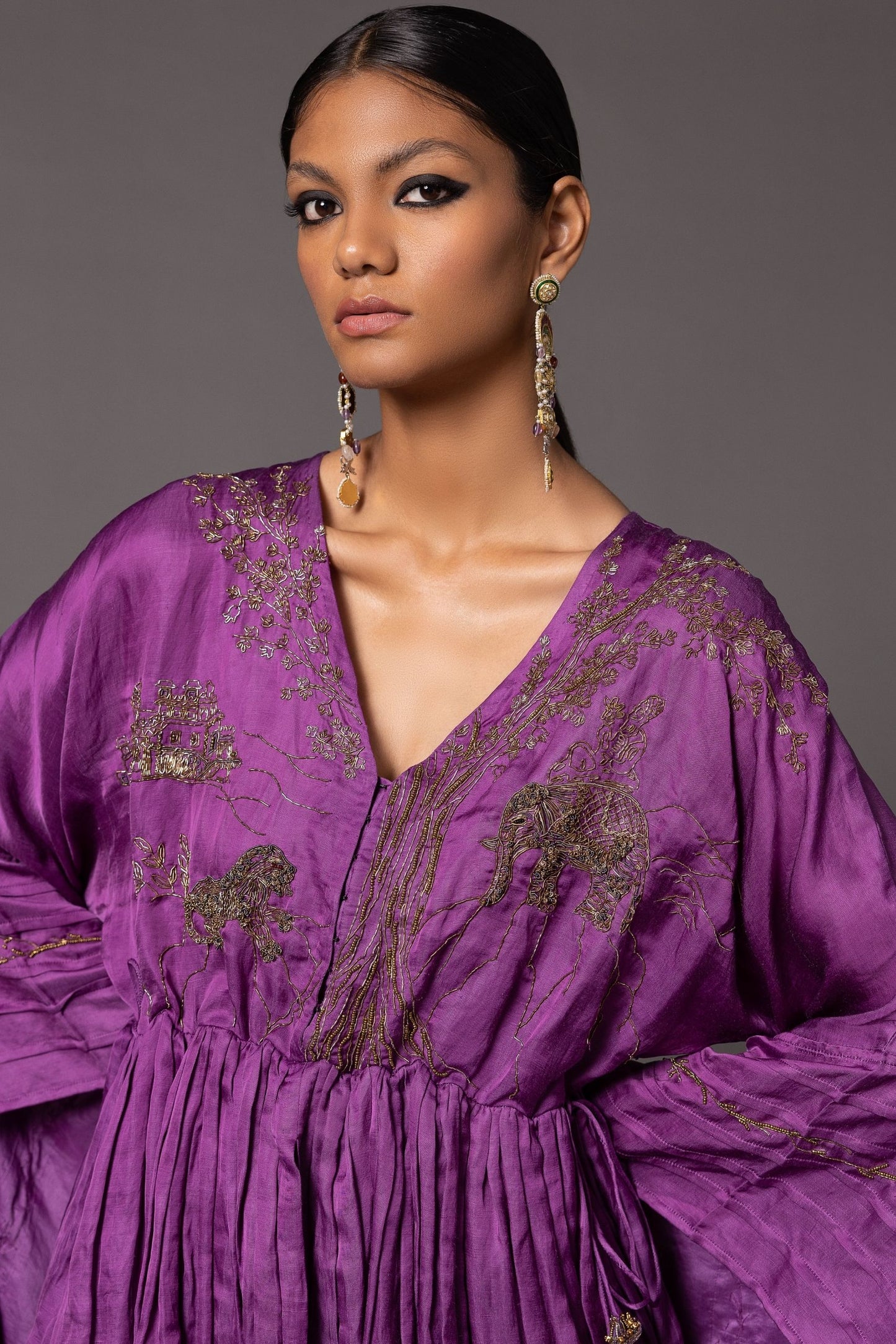 Close-up of the contemporary metallic embroidery featuring Jaipur motifs on the purple peplum top