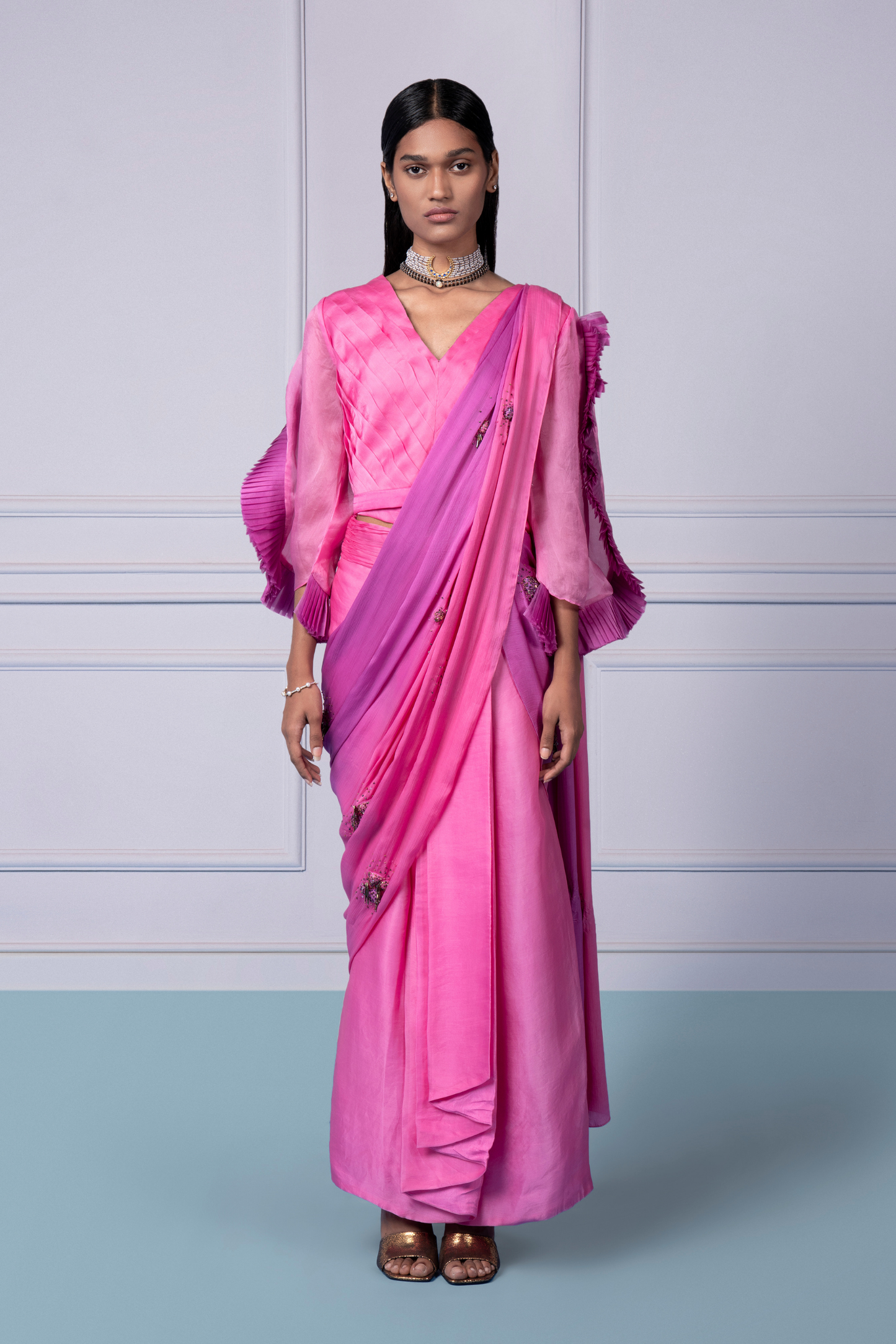 Pink lehenga saree set for women, featuring a pleated blouse and textured dupatta, perfect for stylish and elegant occasions