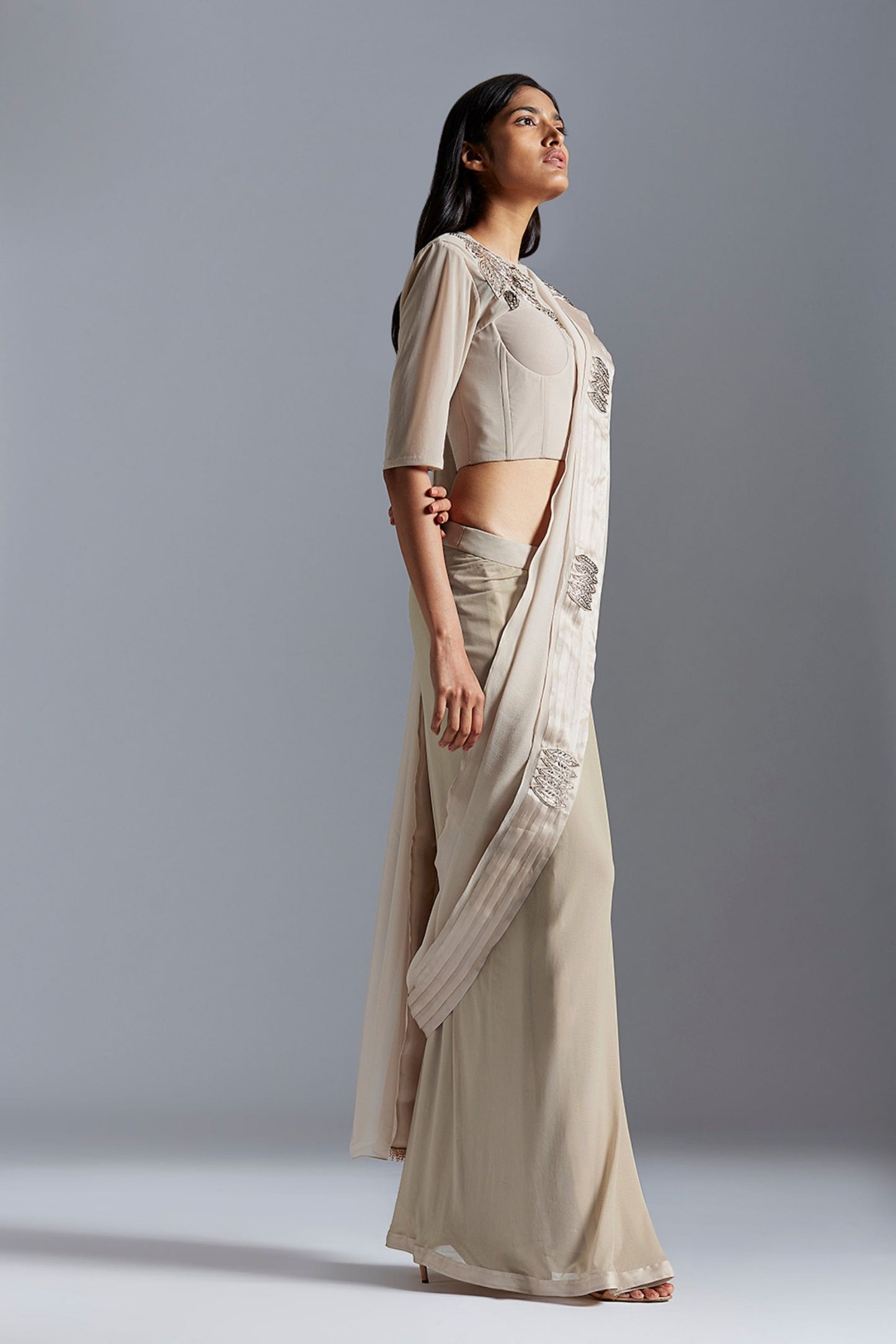 Side profile of the corset blouse top with saree, emphasizing the flattering fit and beautiful embroidery details