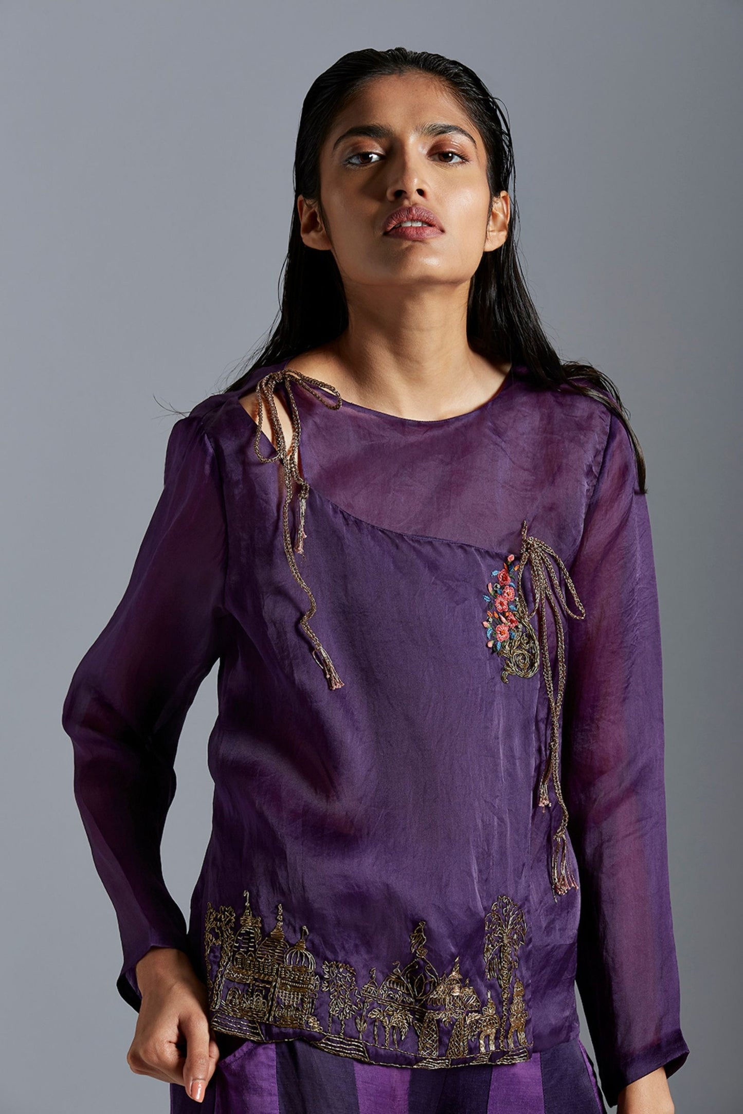 Close-up of the metallic embroidery on the satin organza Angarakha coat, highlighting its intricate design and craftsmanship