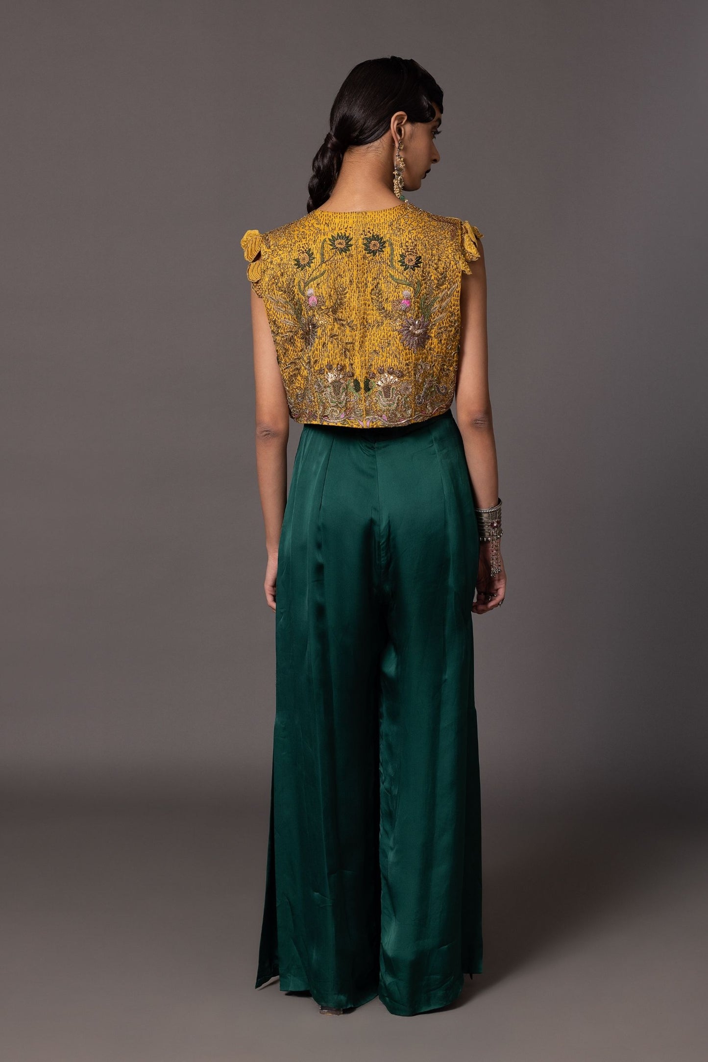 Back view of the Namib Bottle Green Jumpsuit and Paro Cropped Embroidered Jacket, highlighting the overall look and intricate embroidery