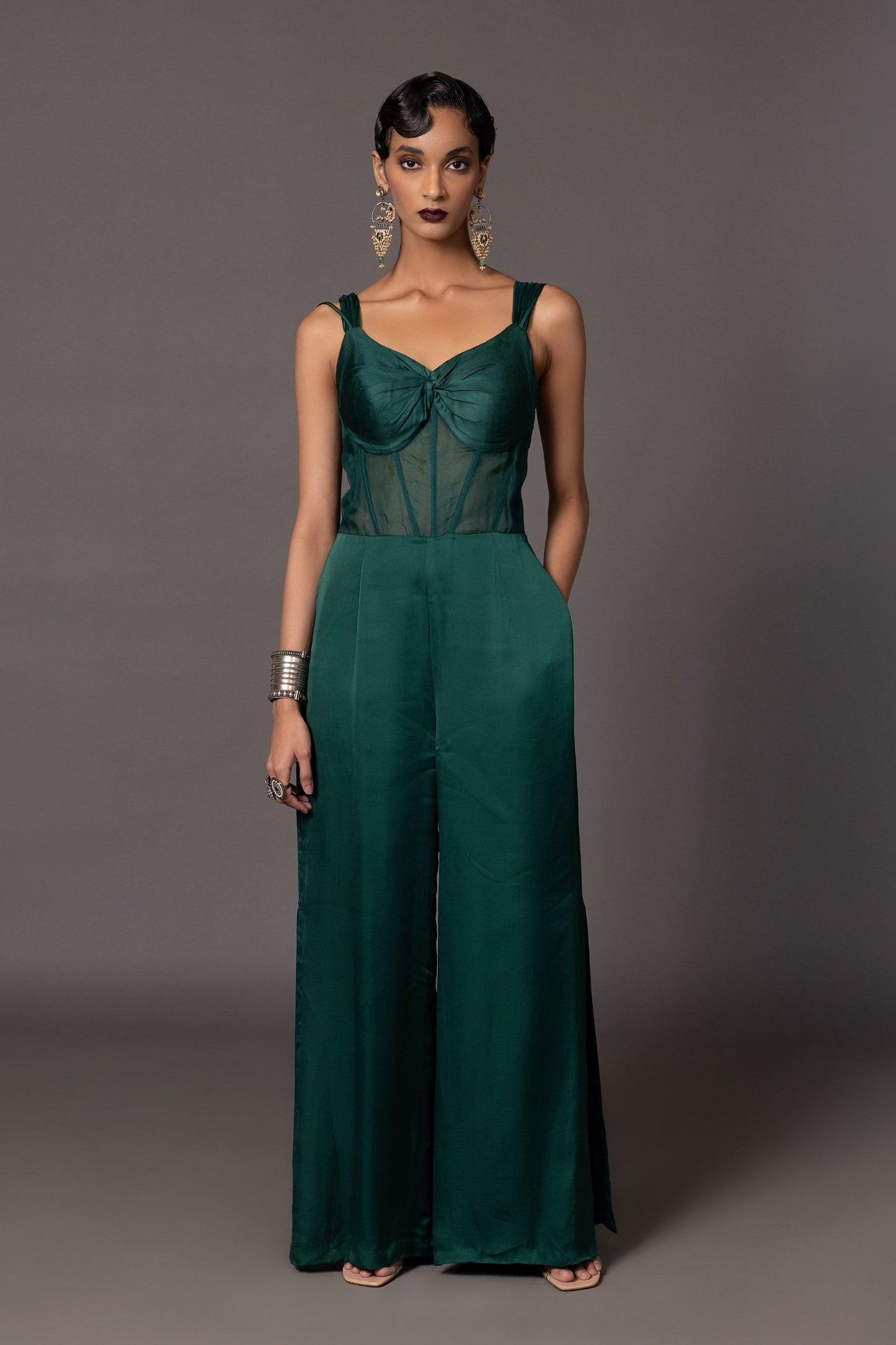 Namib Bottle Green Women's Designer Jumpsuit with knotted bodice, sheer corset construction, and stylish side slits, perfect for any occasion