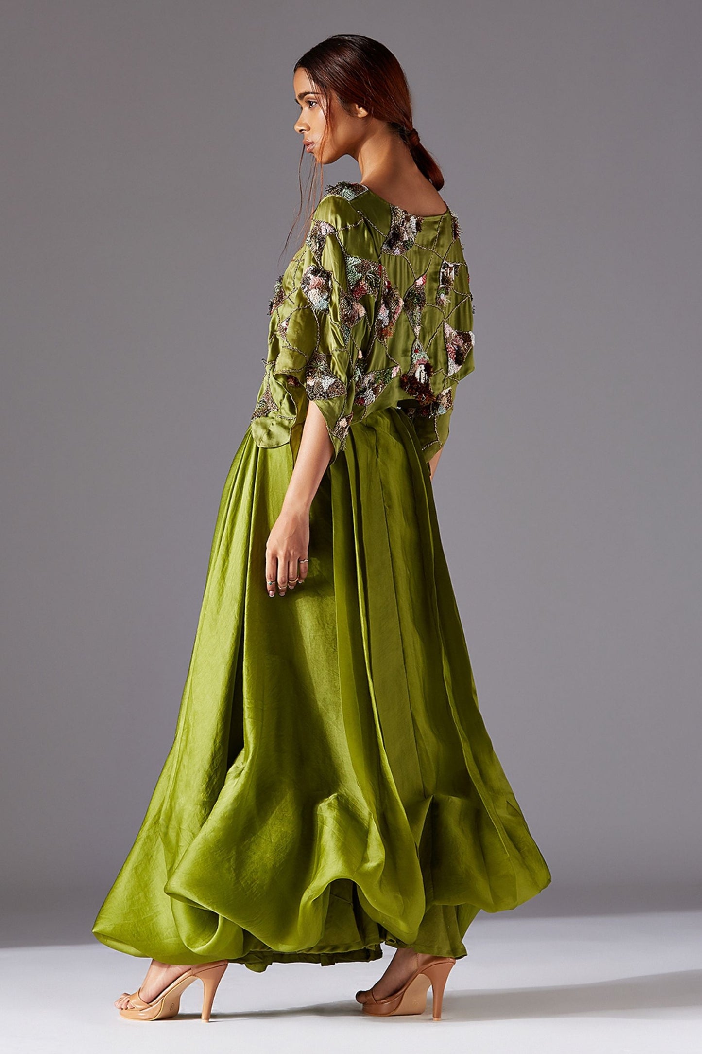Side View of Green Satin Crop Top with Draped Skirt - Elegant Designer Outfit for Women