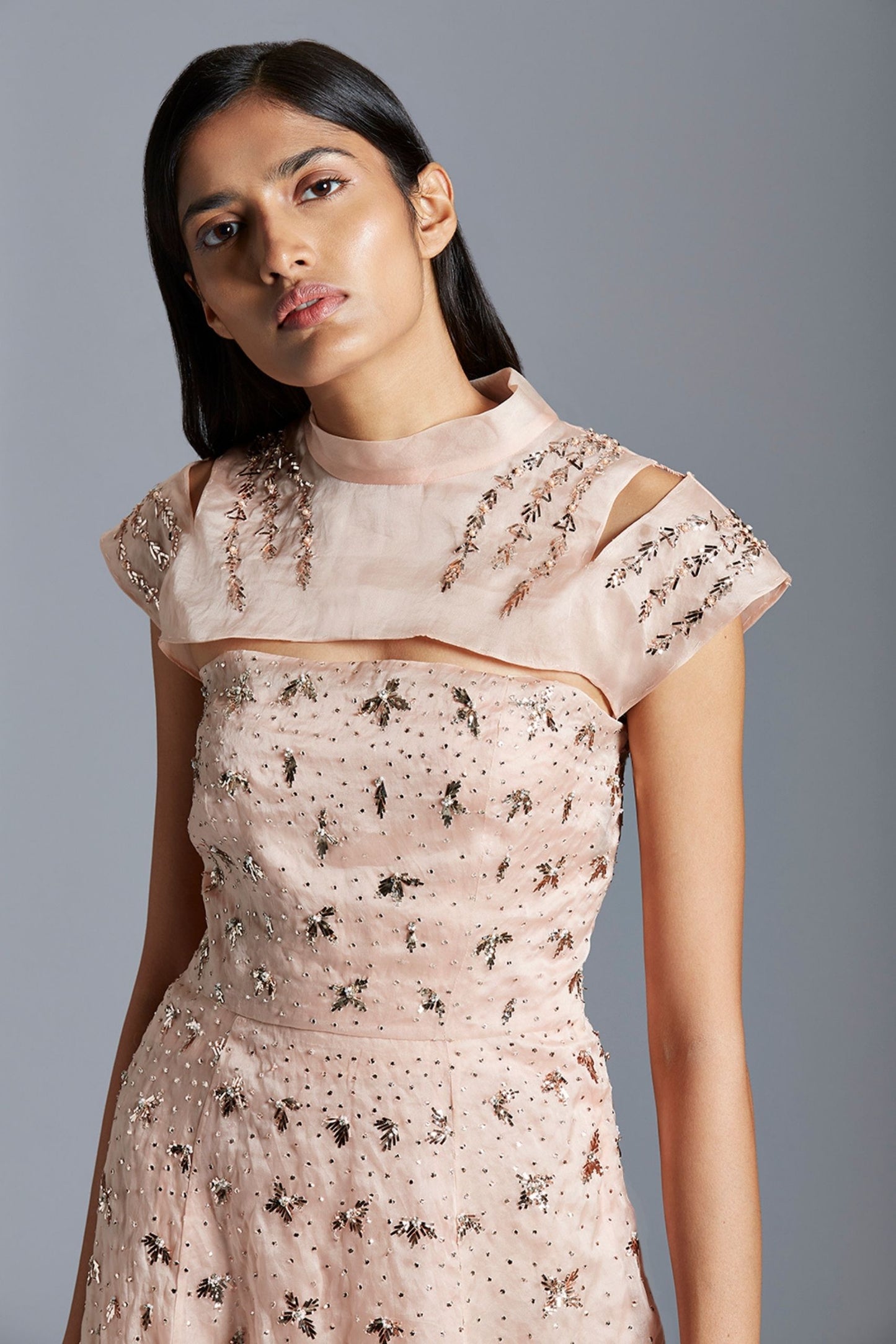 Close-up of the handmade mukaish embroidery on the satin organza gown, showcasing the delicate craftsmanship and design