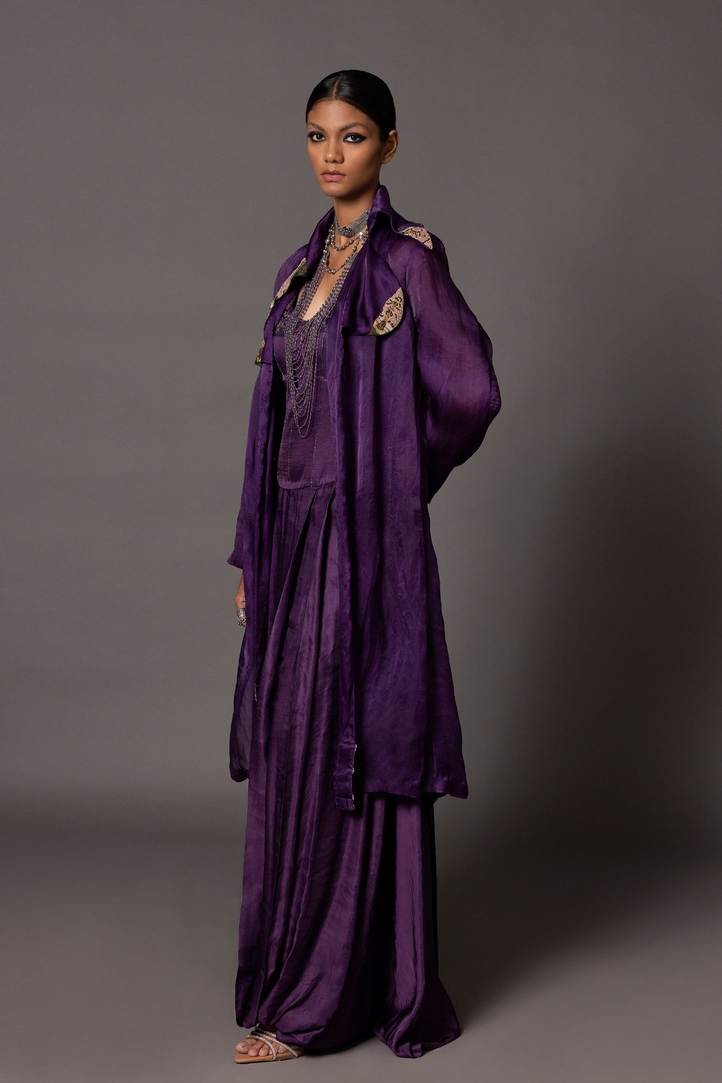 Purple Carpet Jacket with hand-embroidered lapels and Roma purple corset gown with metallic embroidery in luxury fashion