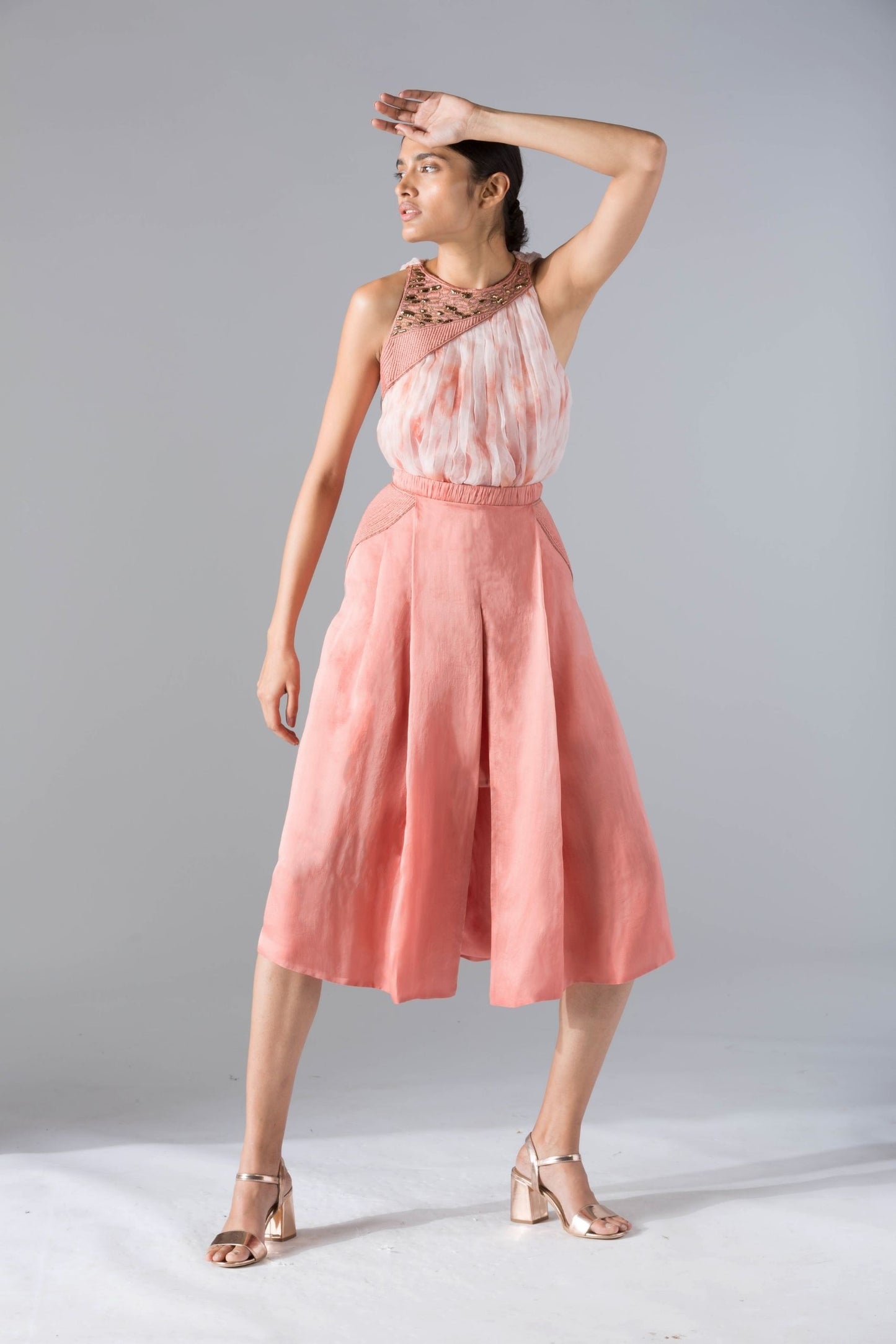 Chic top skirt set for women featuring a batik-dyed rouched crop top and pleated pant skirt with rope inlayed details, offering an elegant and stylish look