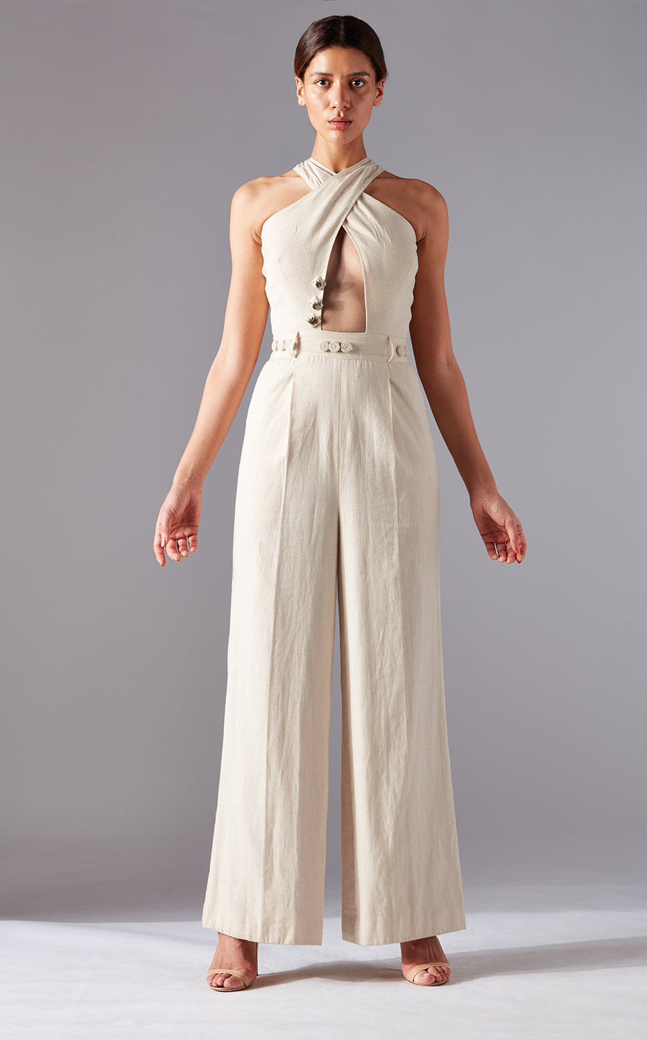 Modern stylish jumpsuit for women in natural khadi with cross-body design and wide-leg fit, showcasing a chic and unique style